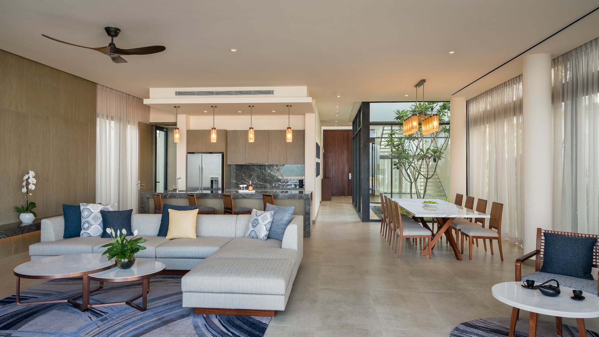 a living room with a couch and dining table