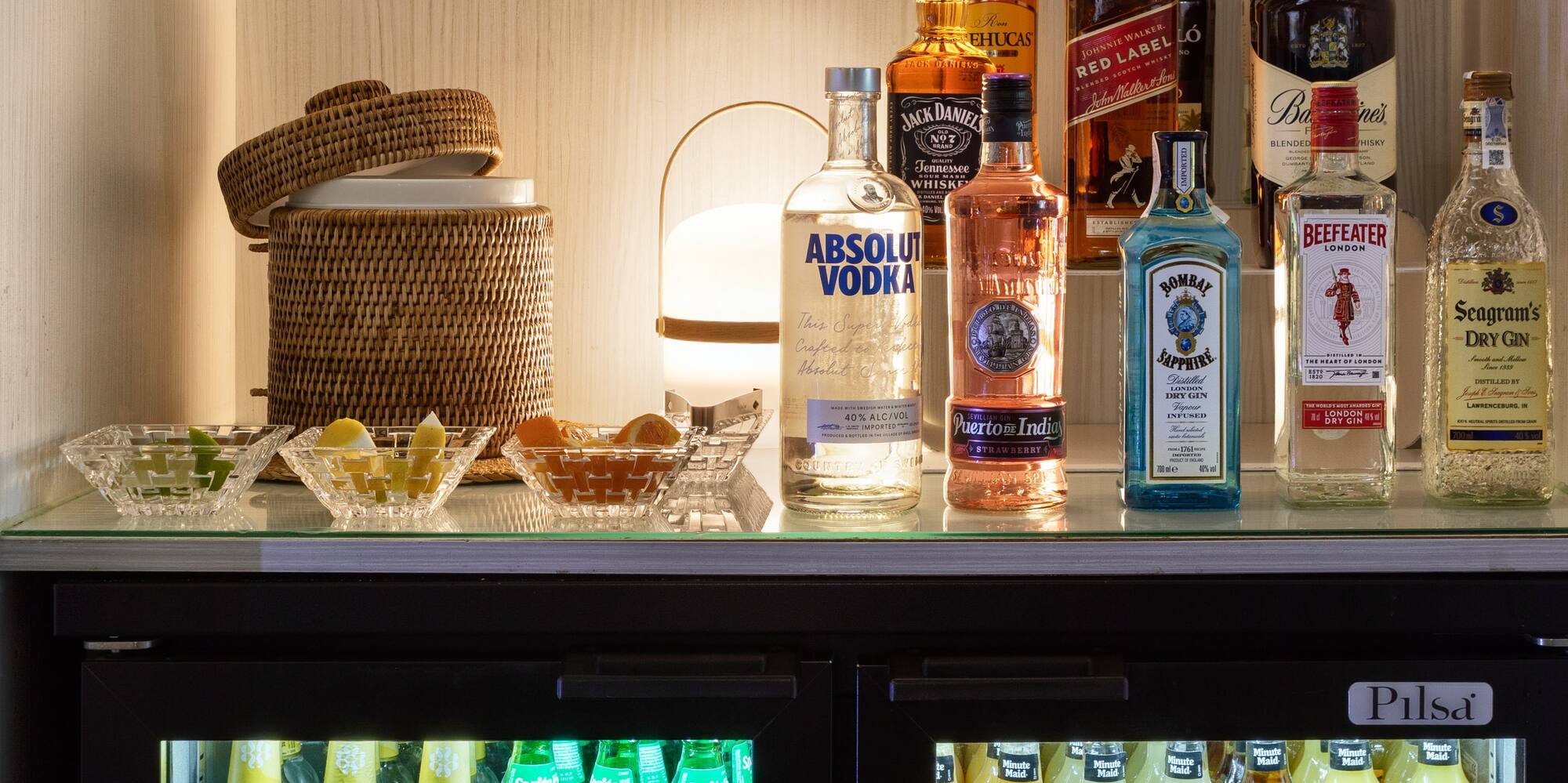 a shelf with bottles of alcohol and drinks