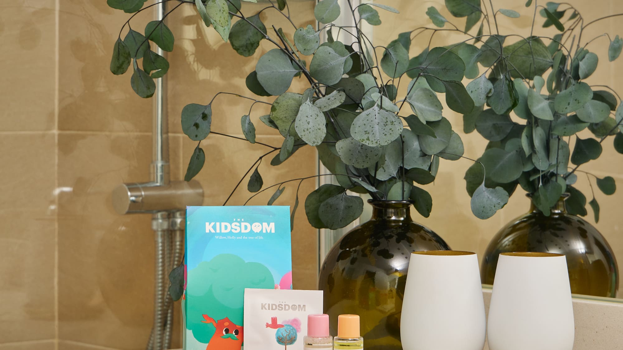 a bathroom counter with a couple of white objects on it