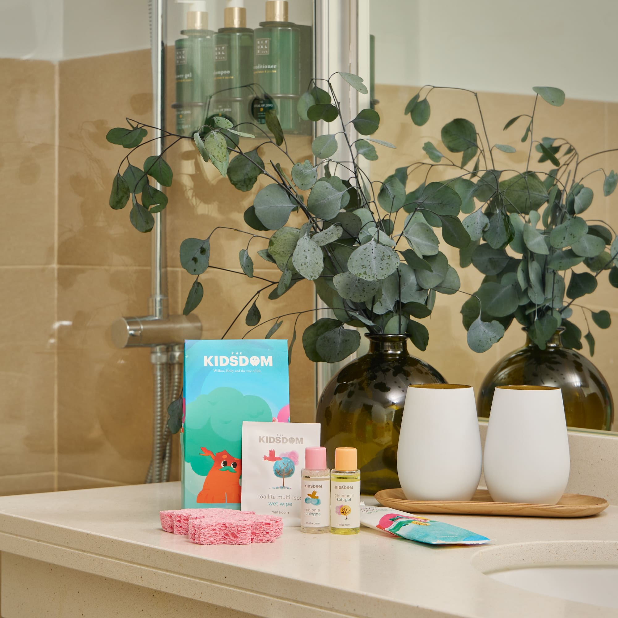 a bathroom counter with a couple of white objects on it