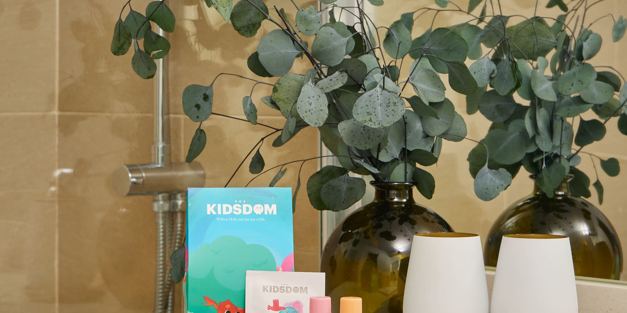 a bathroom counter with a couple of white objects on it