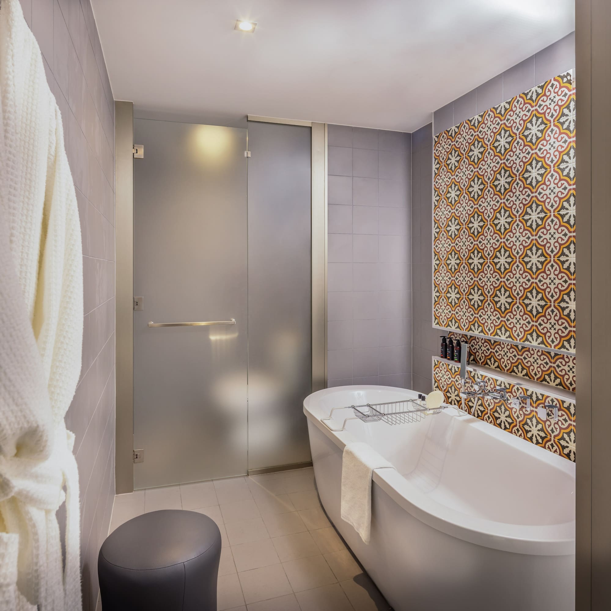 a bathroom with a tub and a shower