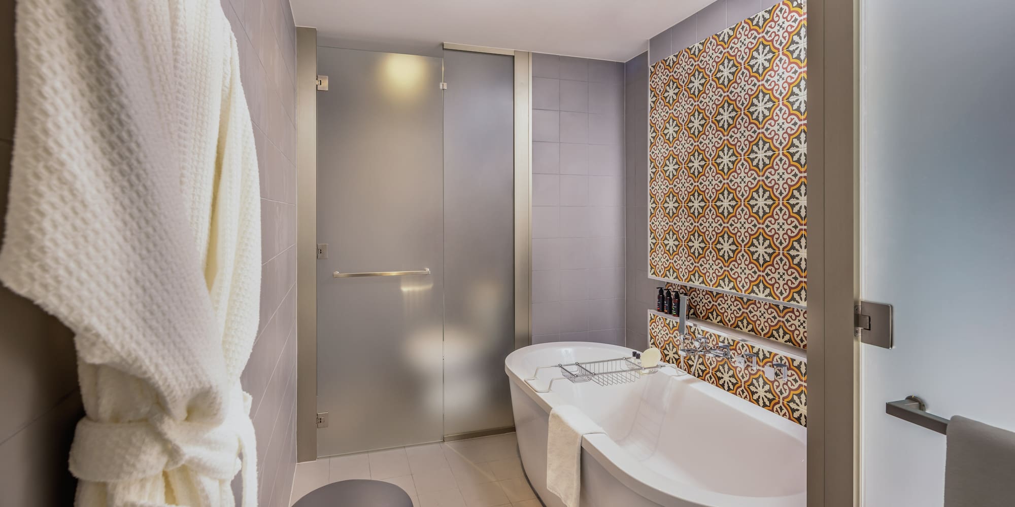 a bathroom with a tub and a shower