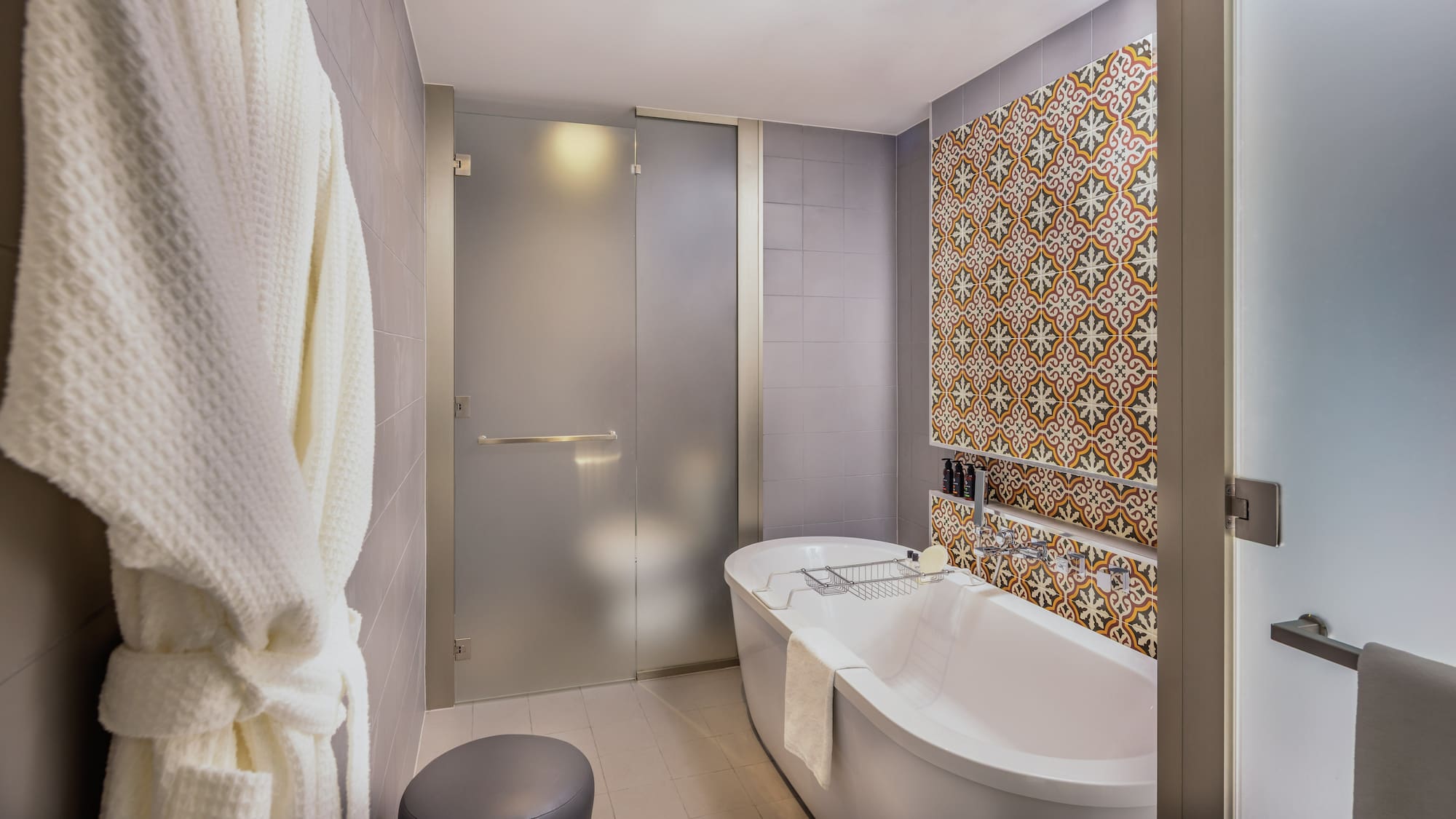 a bathroom with a tub and a shower