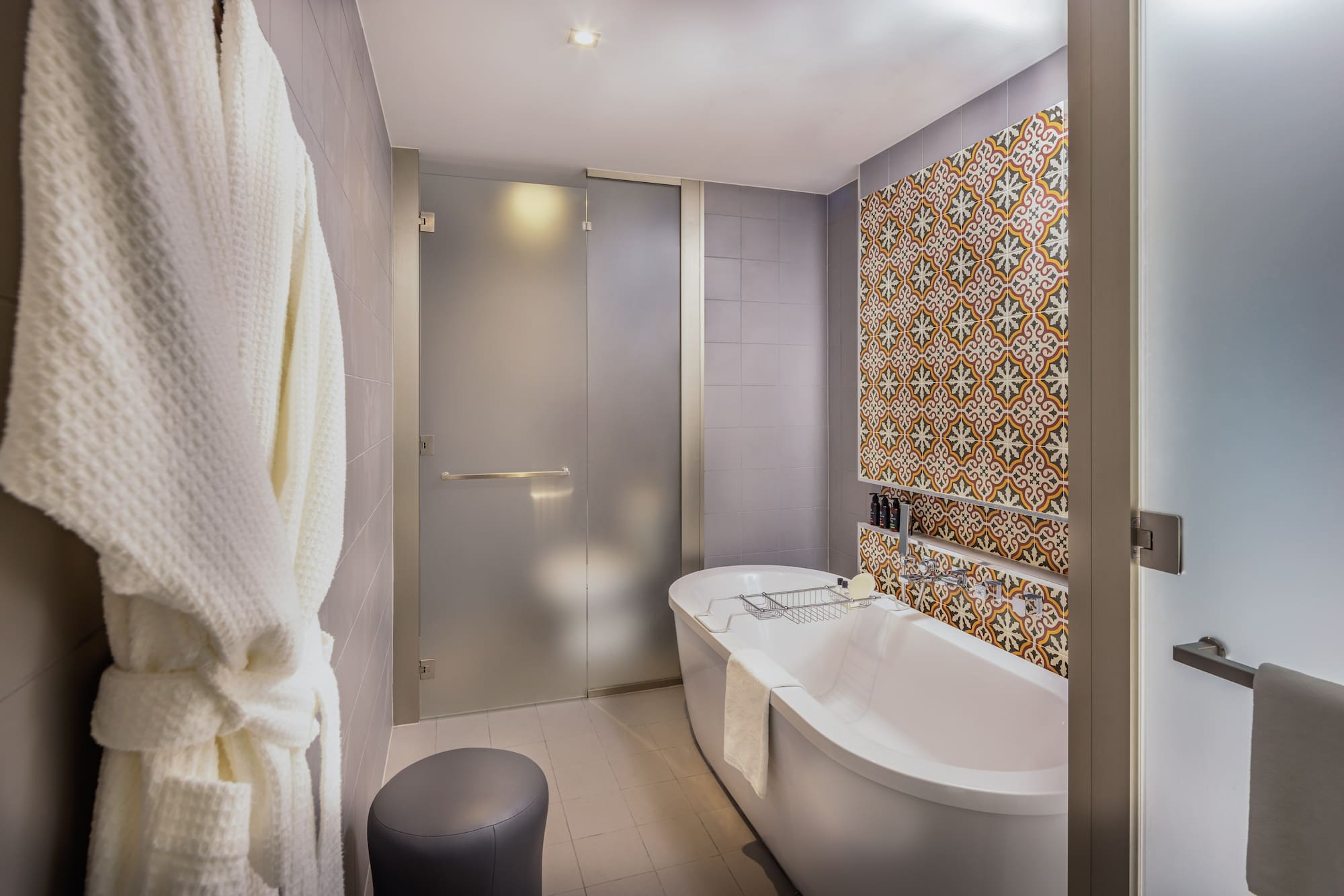 a bathroom with a tub and a shower