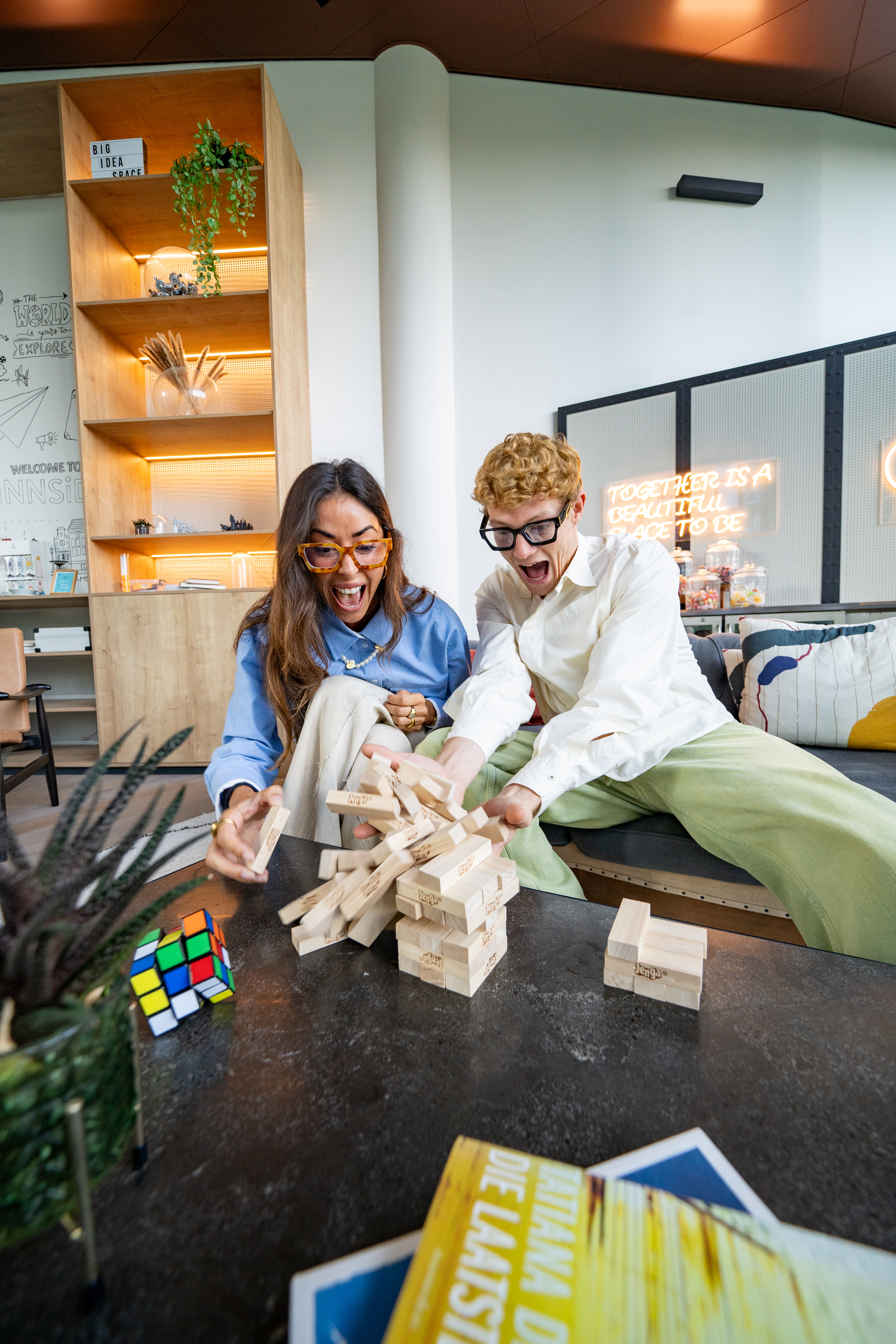 a man and woman playing with blocks