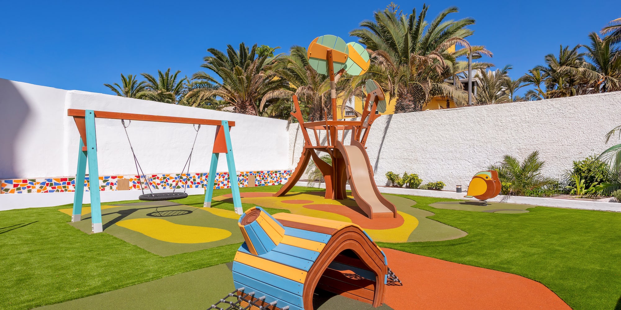 a playground with a swing and a slide