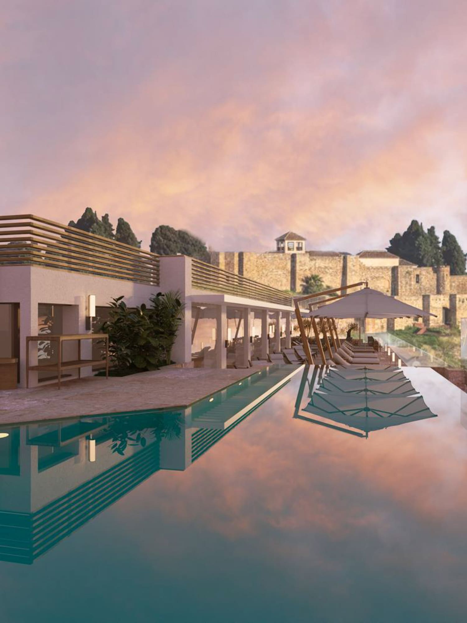 a pool with a building and a stone wall