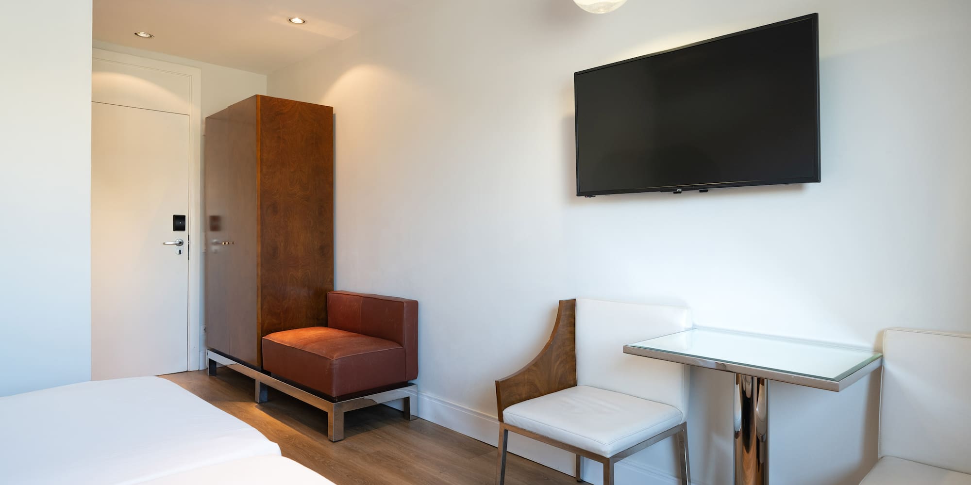 a room with a tv on the wall