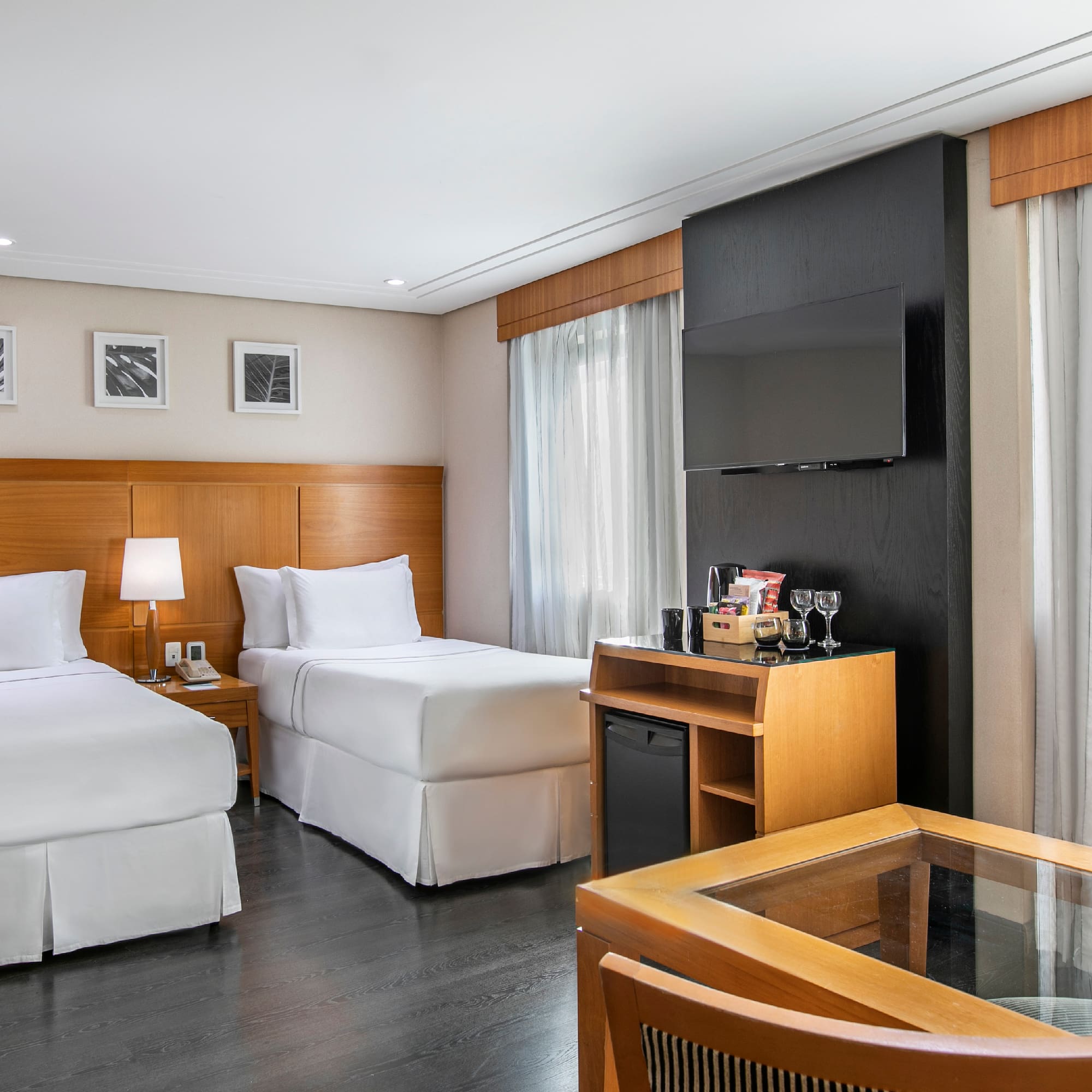 a room with two beds and a tv