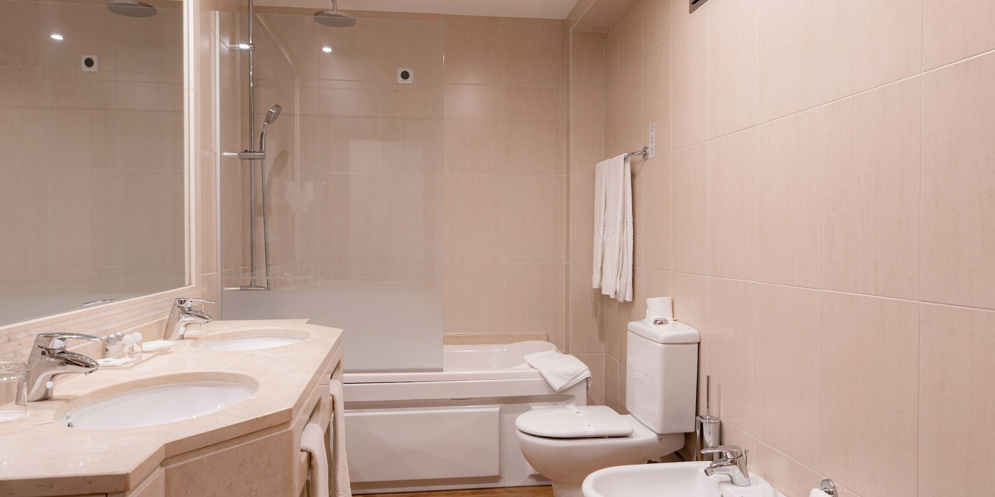 a bathroom with a shower and toilet