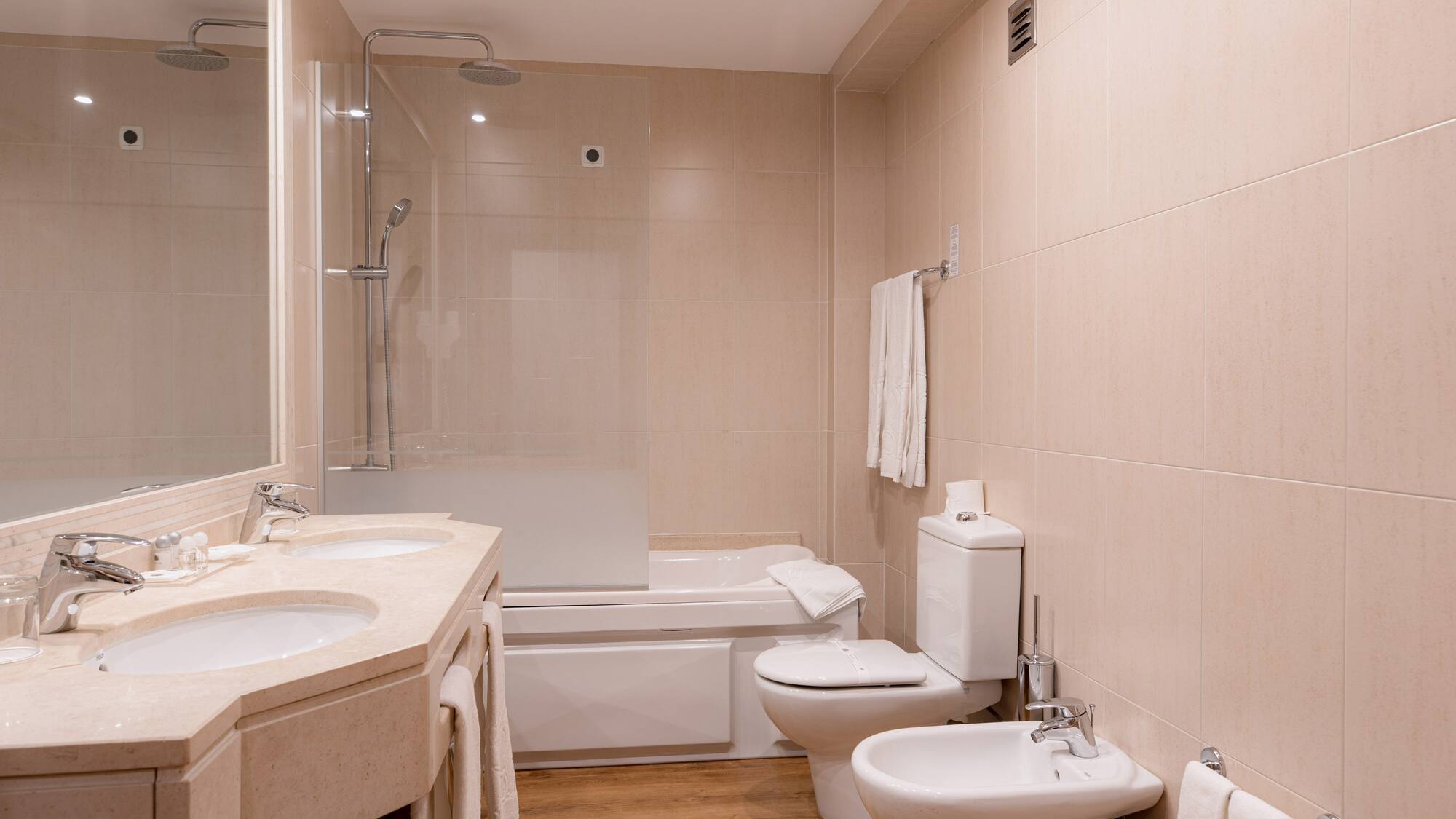 a bathroom with a shower and toilet