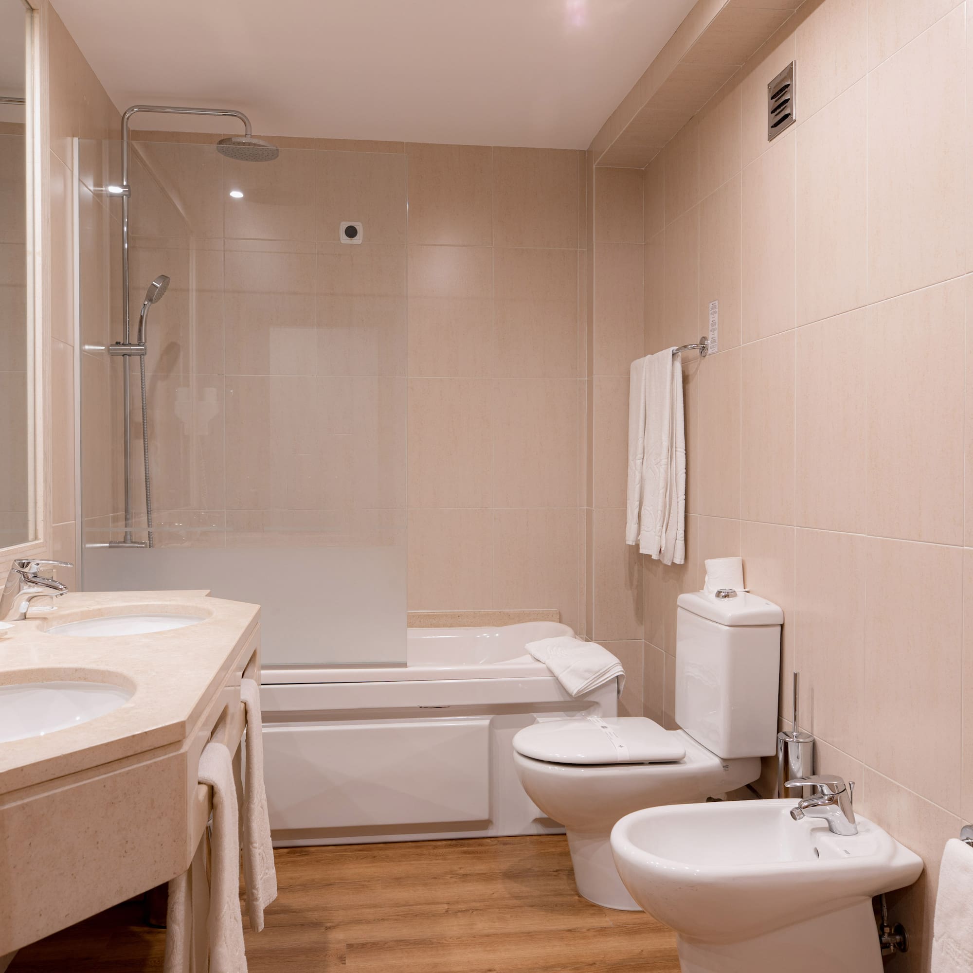 a bathroom with a shower and toilet