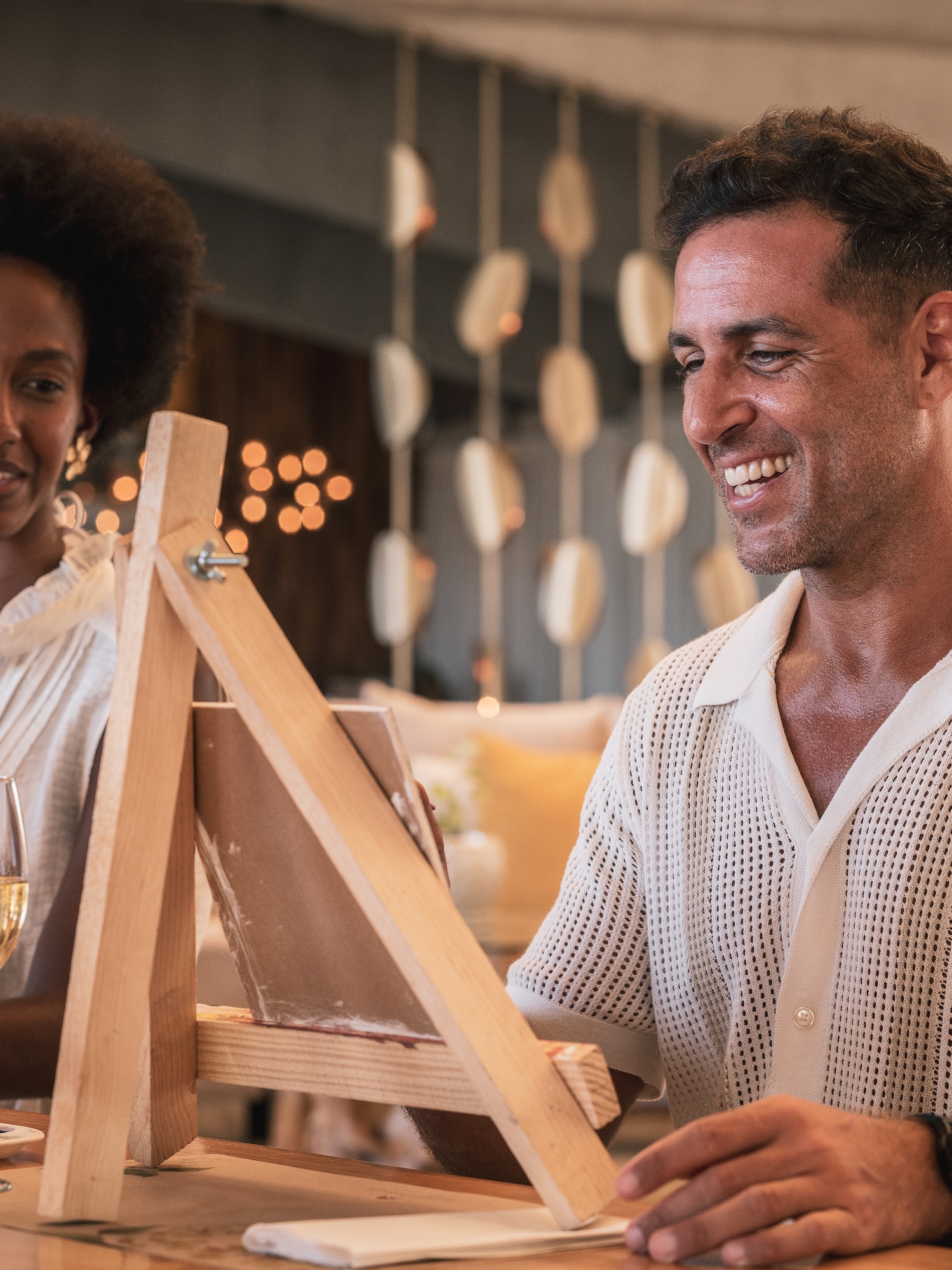 a man and woman sitting at a table