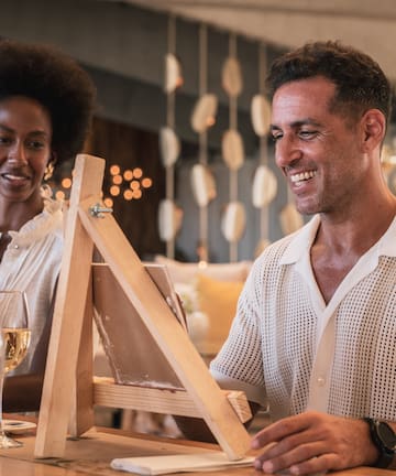 a man and woman sitting at a table