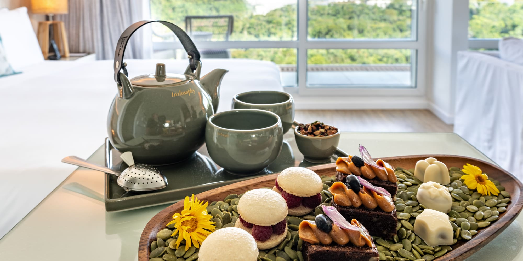 a tray of desserts and tea cups