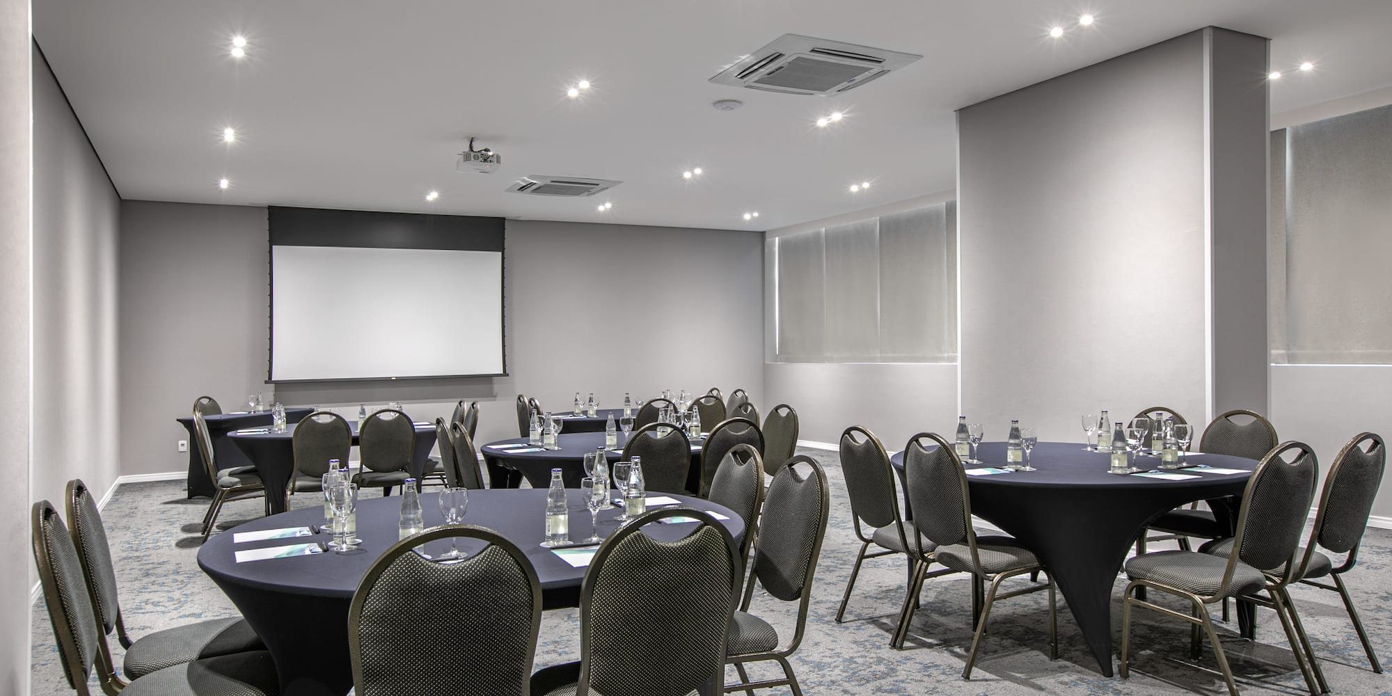 a room with tables and chairs