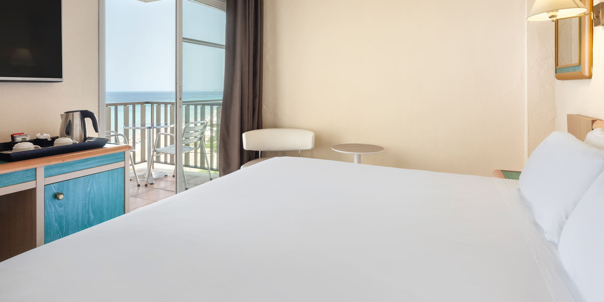 a room with a bed and a balcony