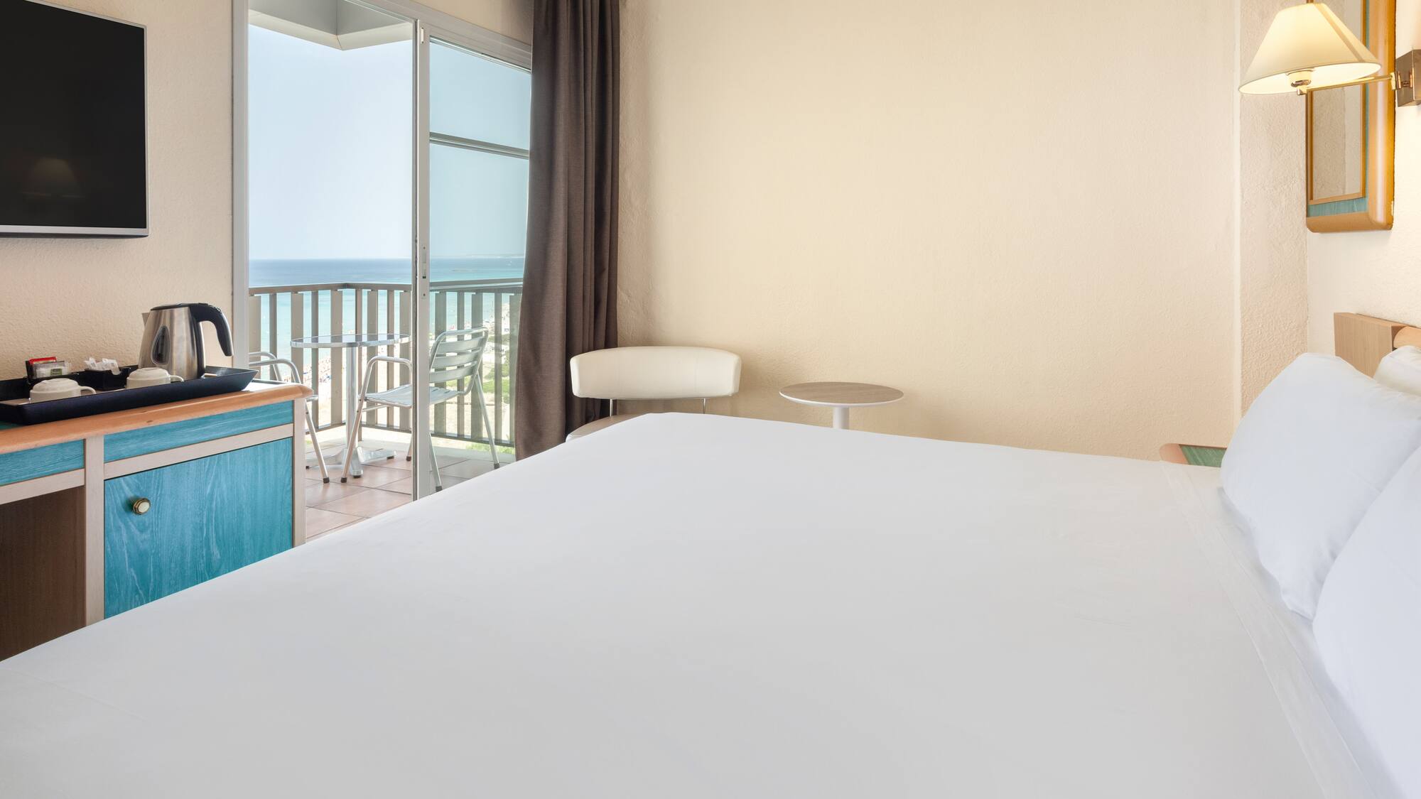 a room with a bed and a balcony