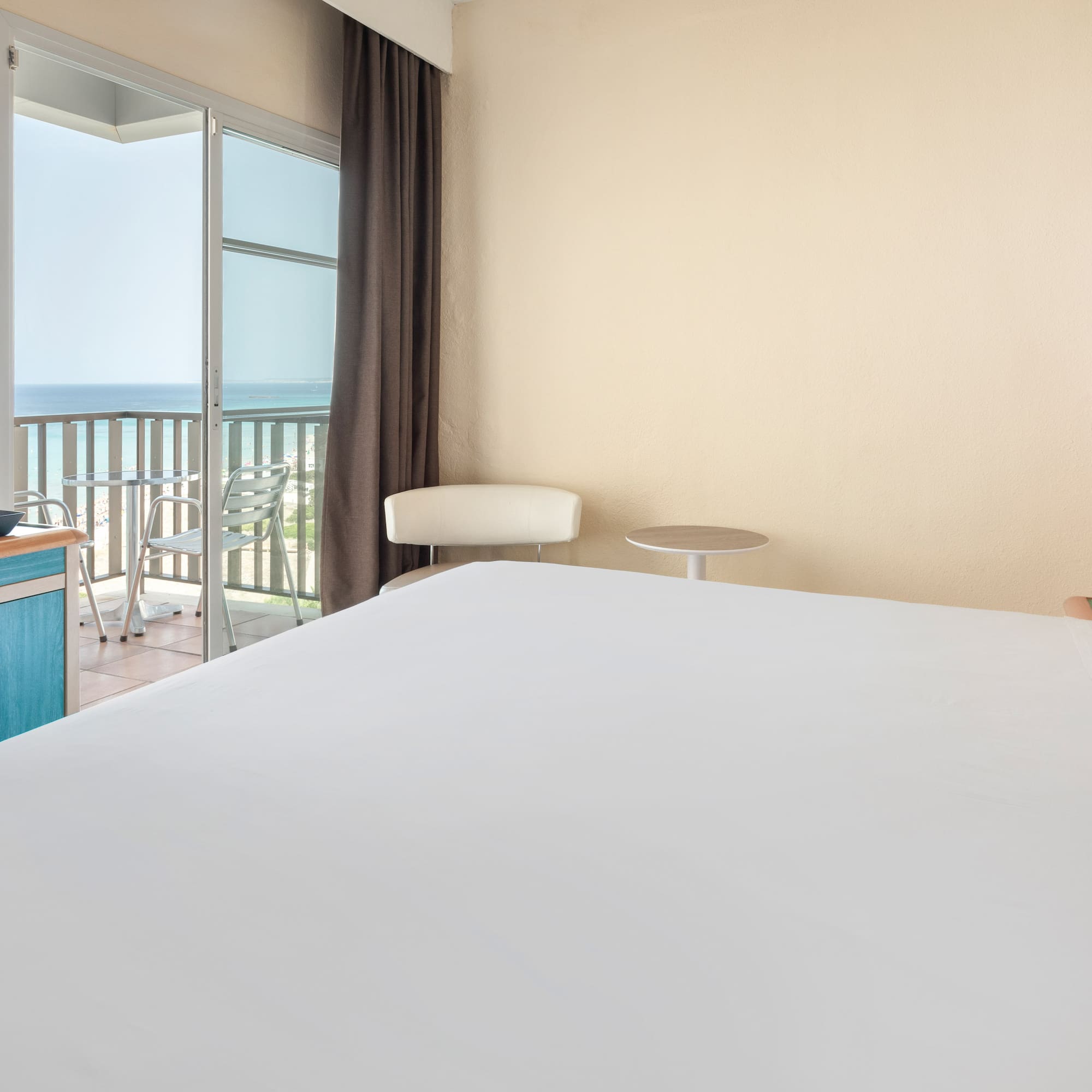 a room with a bed and a balcony