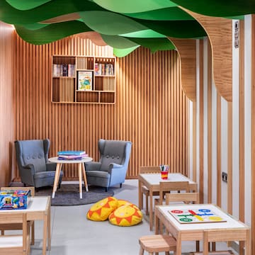 a room with chairs and tables