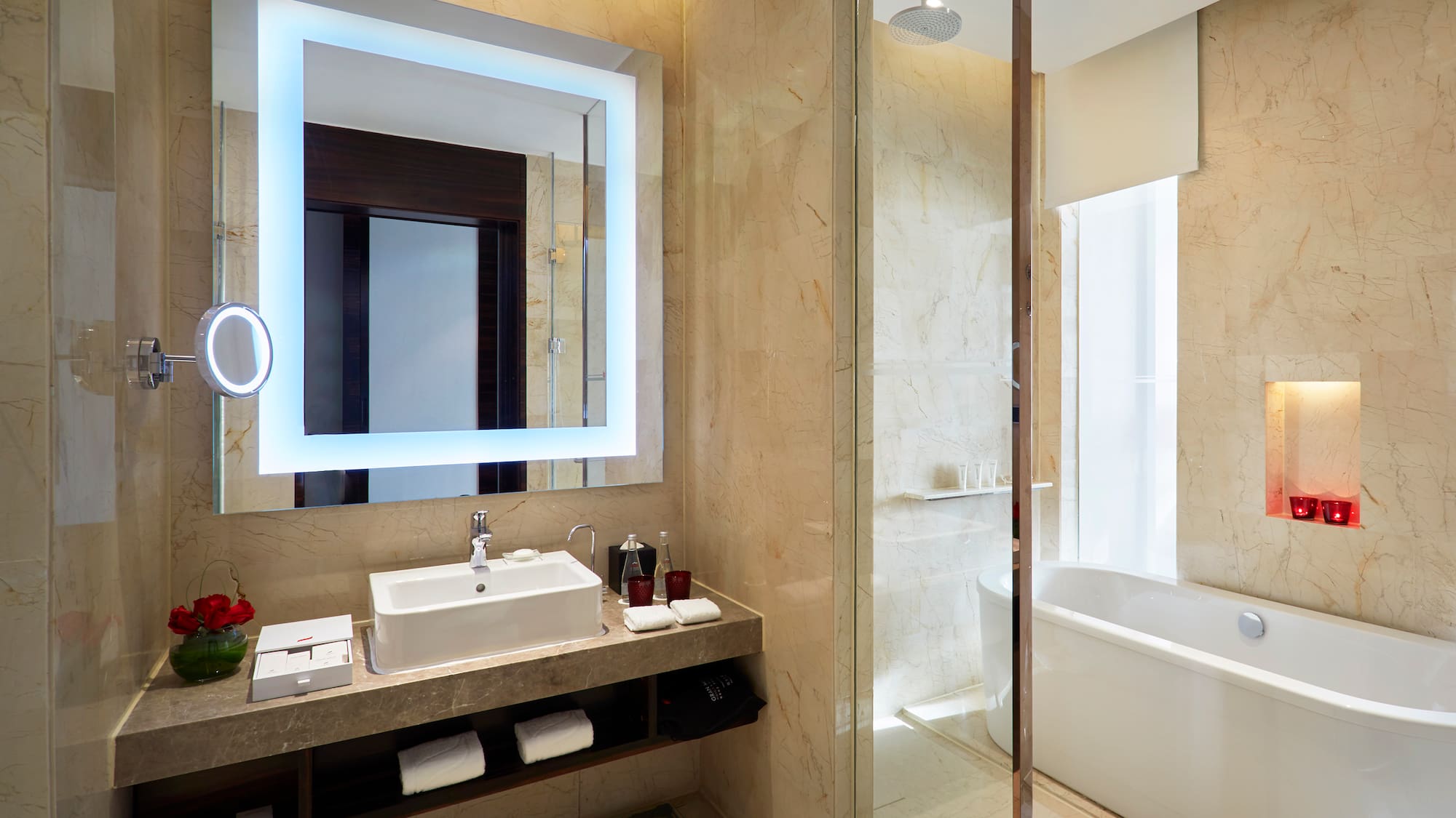 a bathroom with a large mirror and a tub