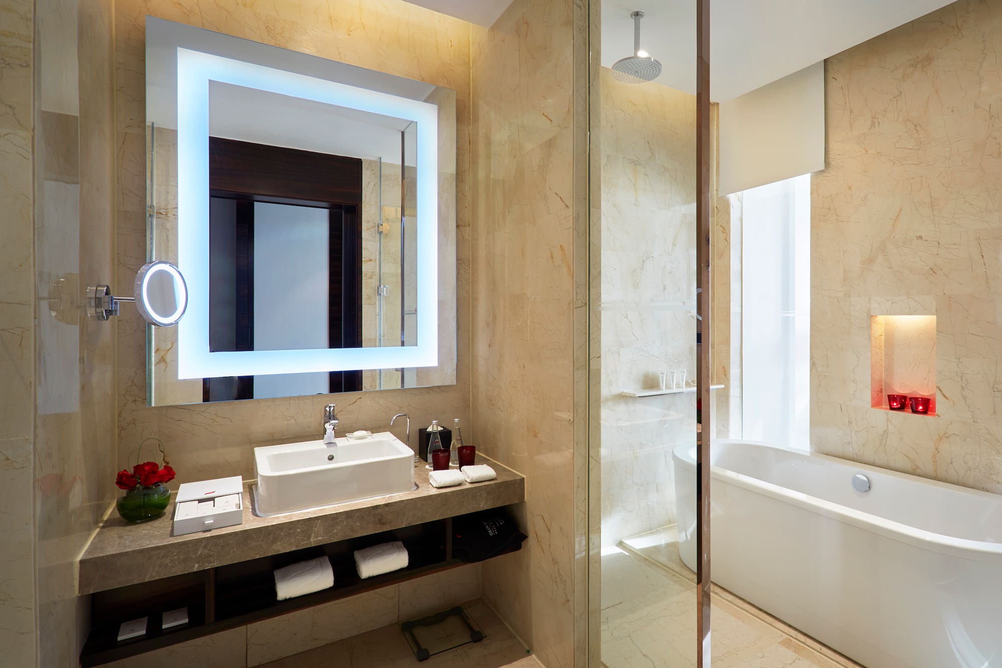 a bathroom with a large mirror and a tub