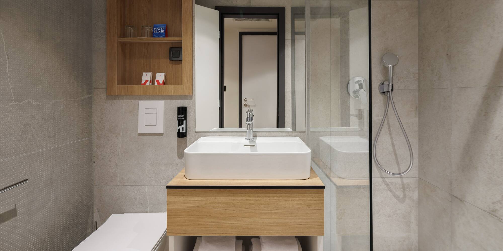 a bathroom with a sink and a shower