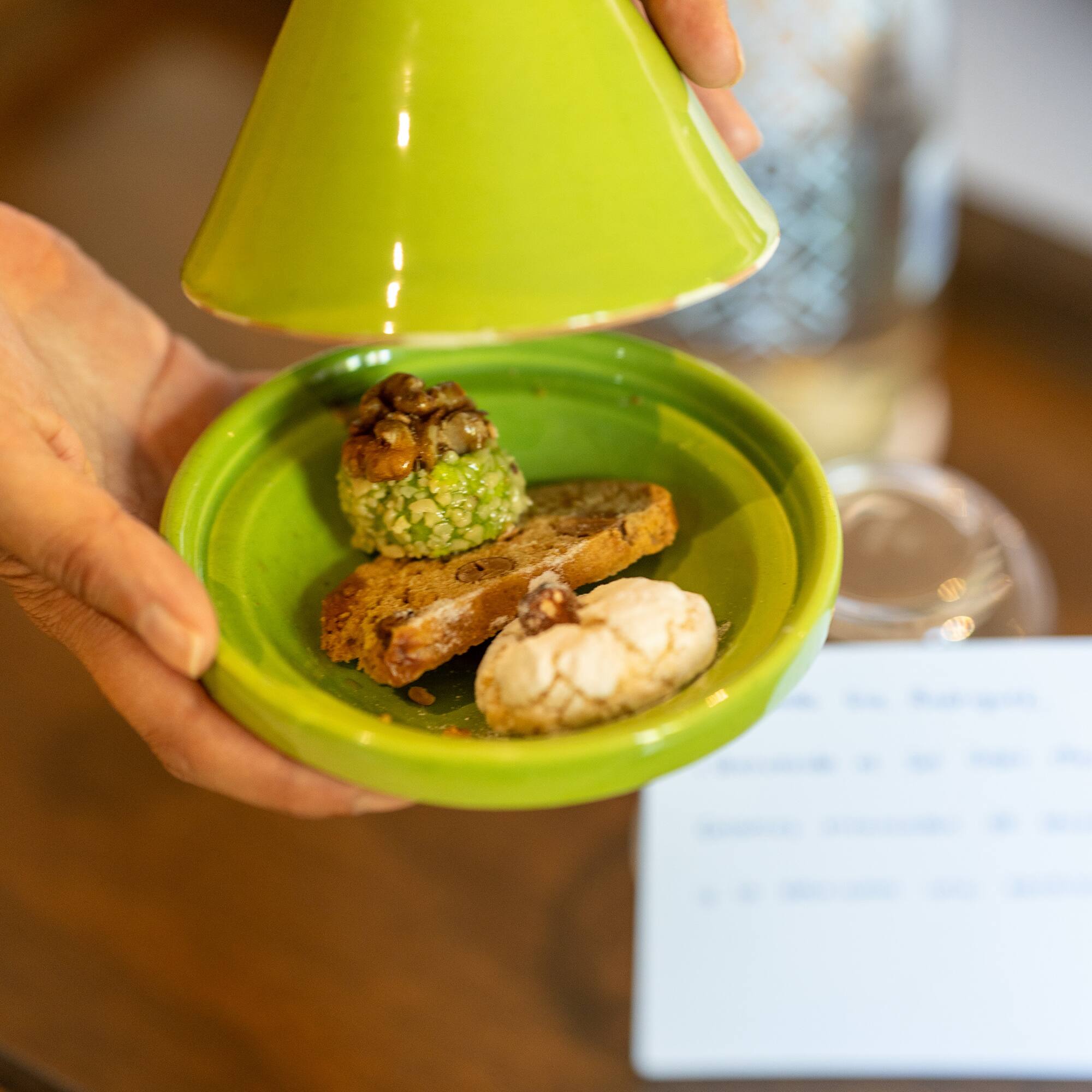 a hand holding a plate of food