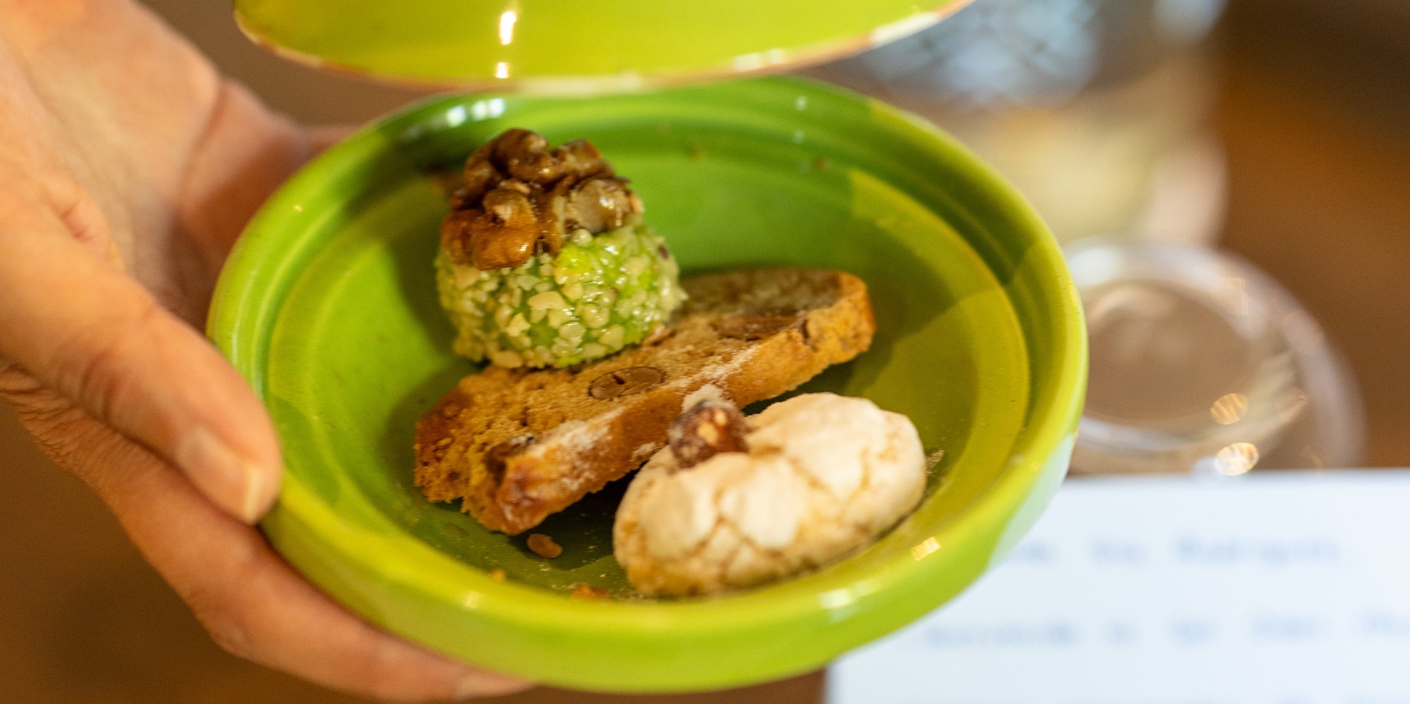 a hand holding a plate of food