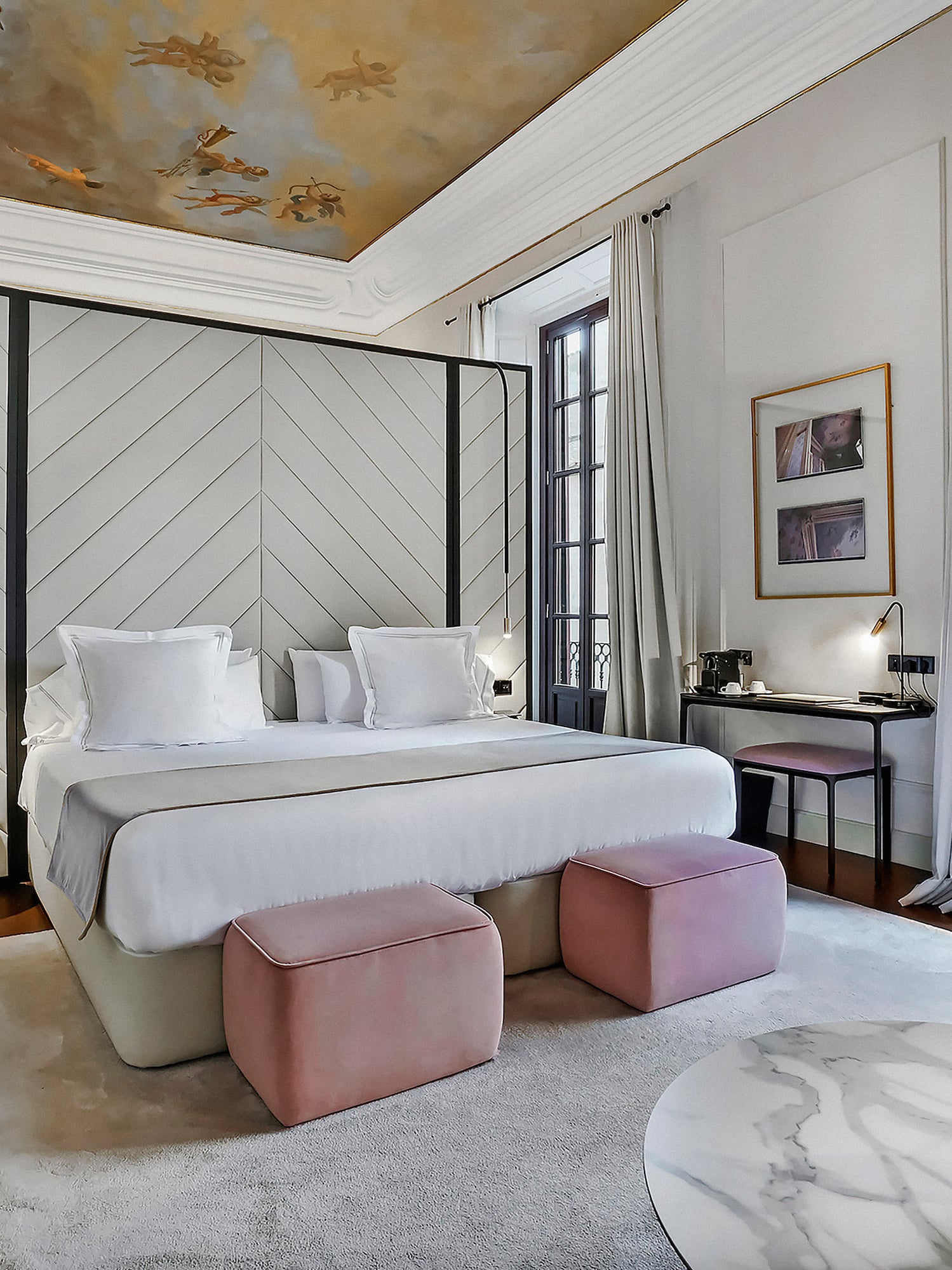 a bedroom with a bed and a table