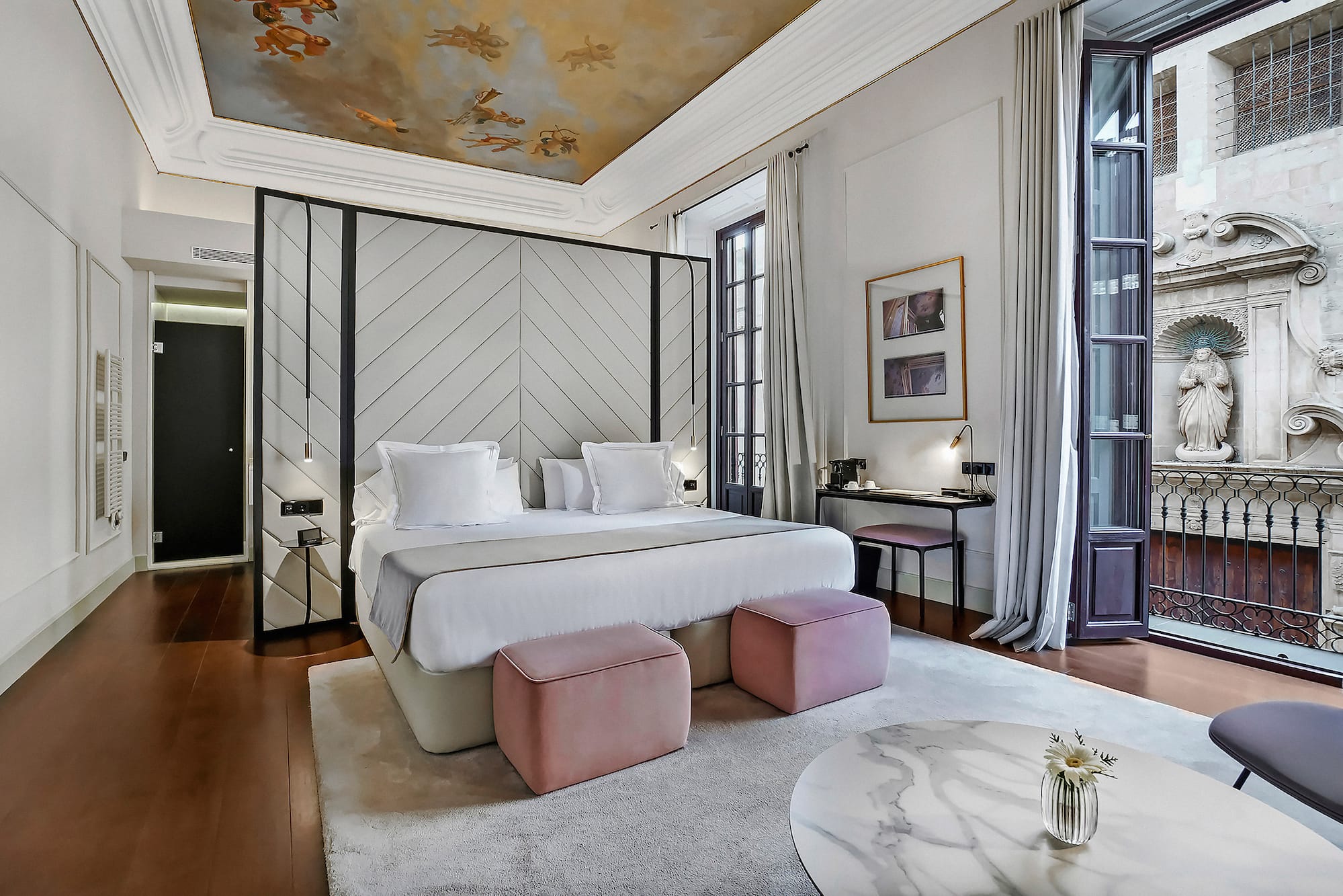 a bedroom with a bed and a table