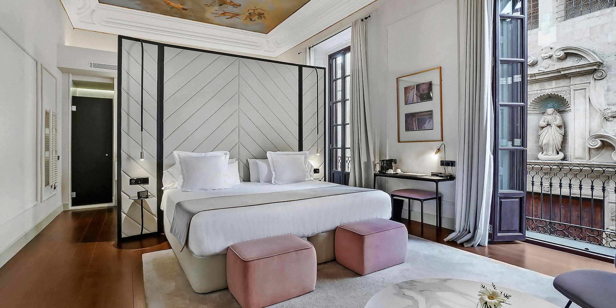 a bedroom with a bed and a table