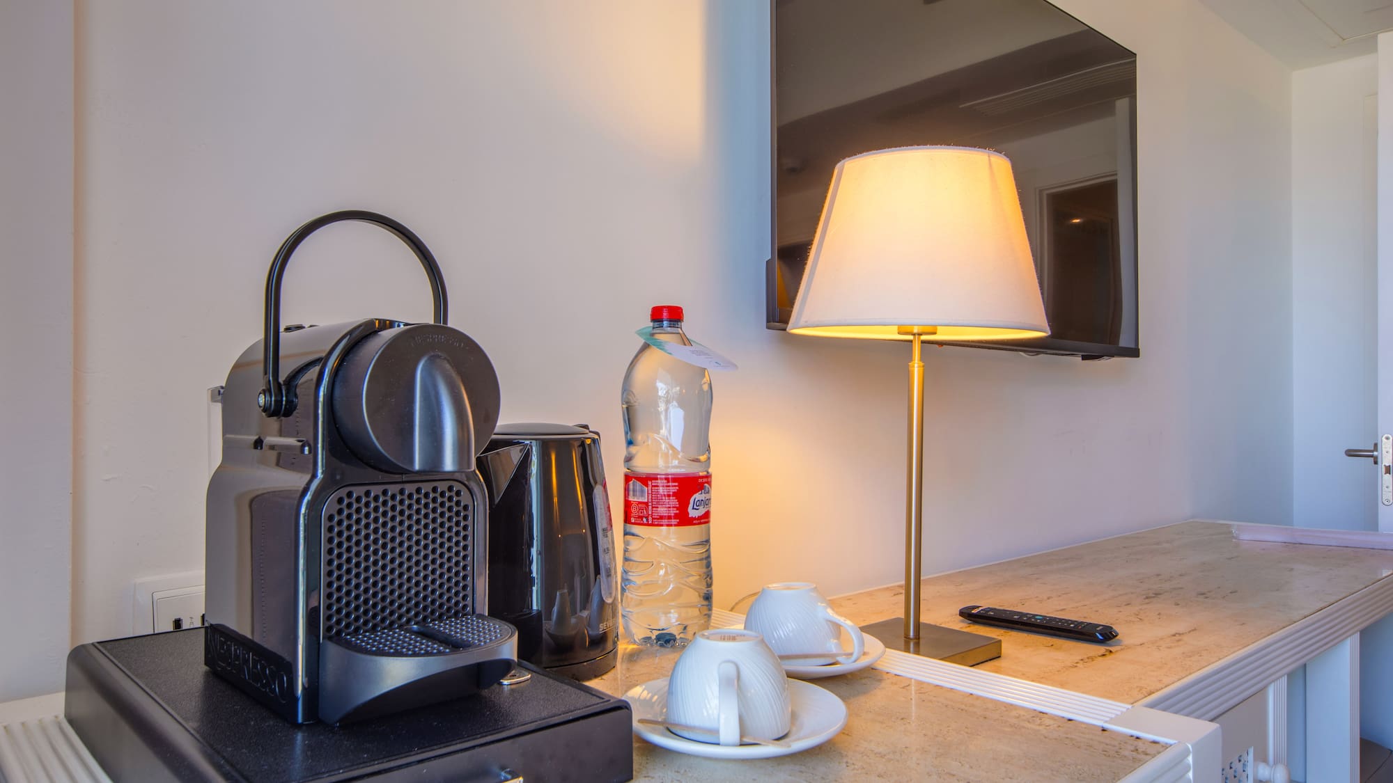 a coffee machine and a lamp on a counter