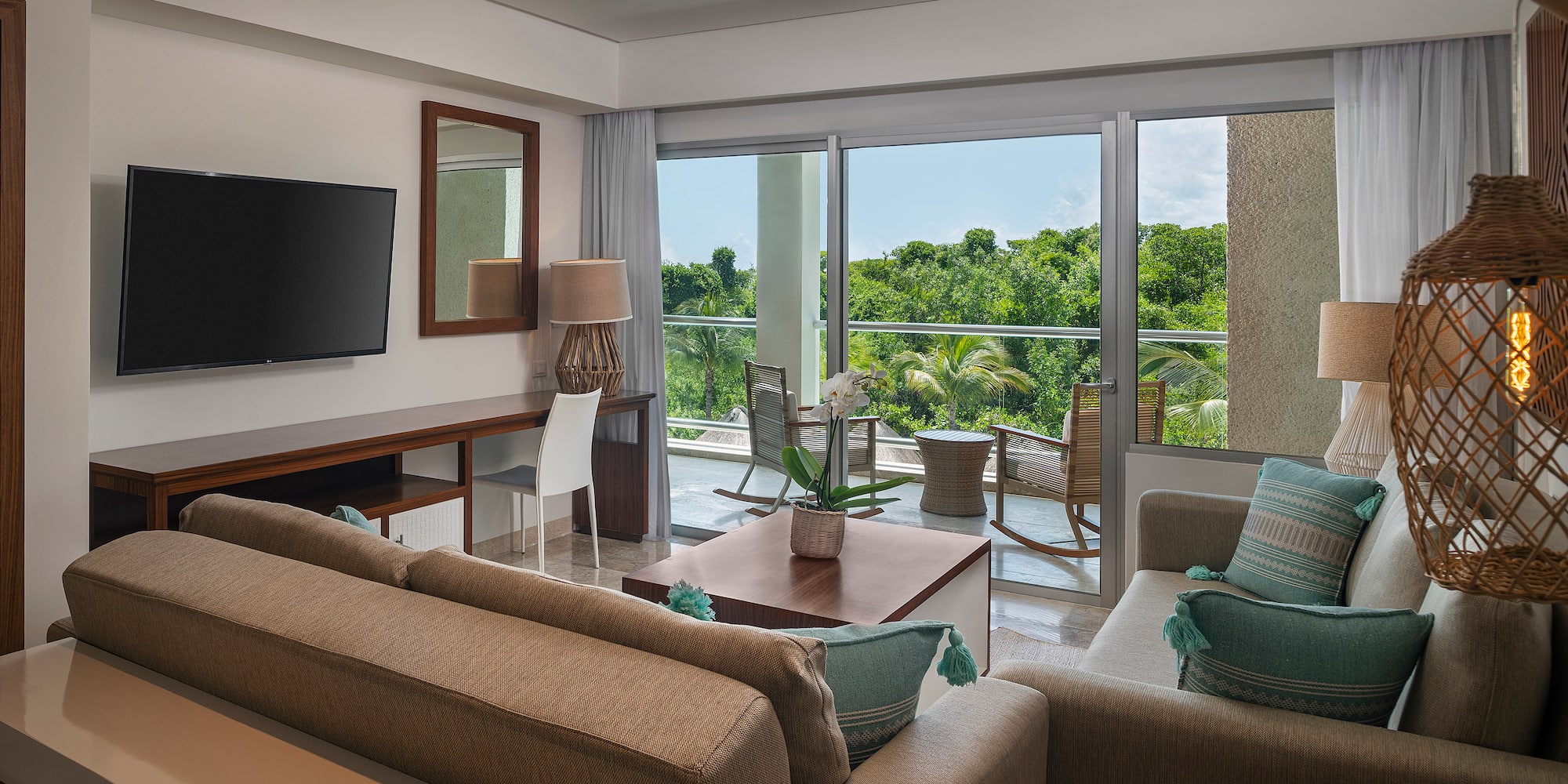 a living room with a television and a couch