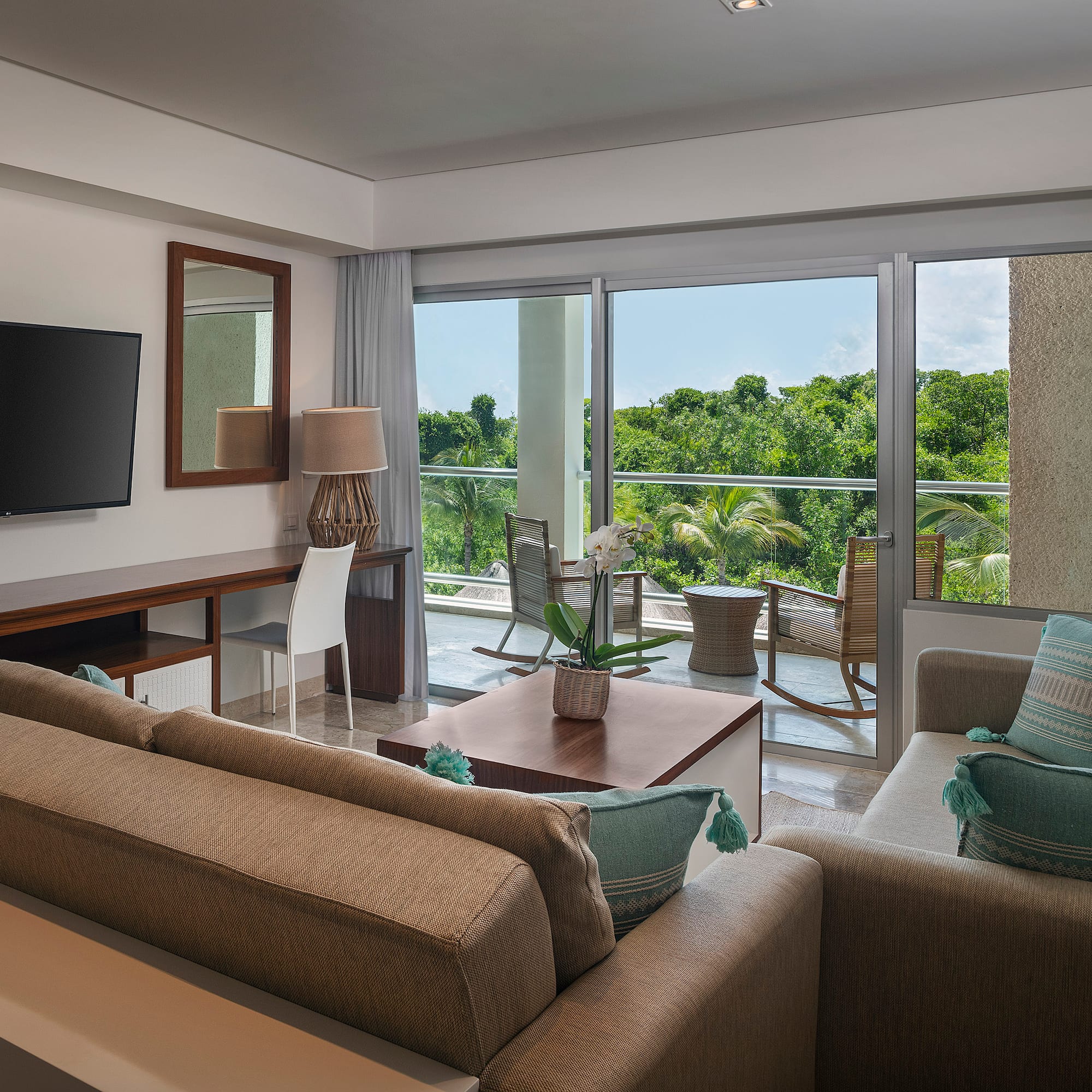 a living room with a television and a couch