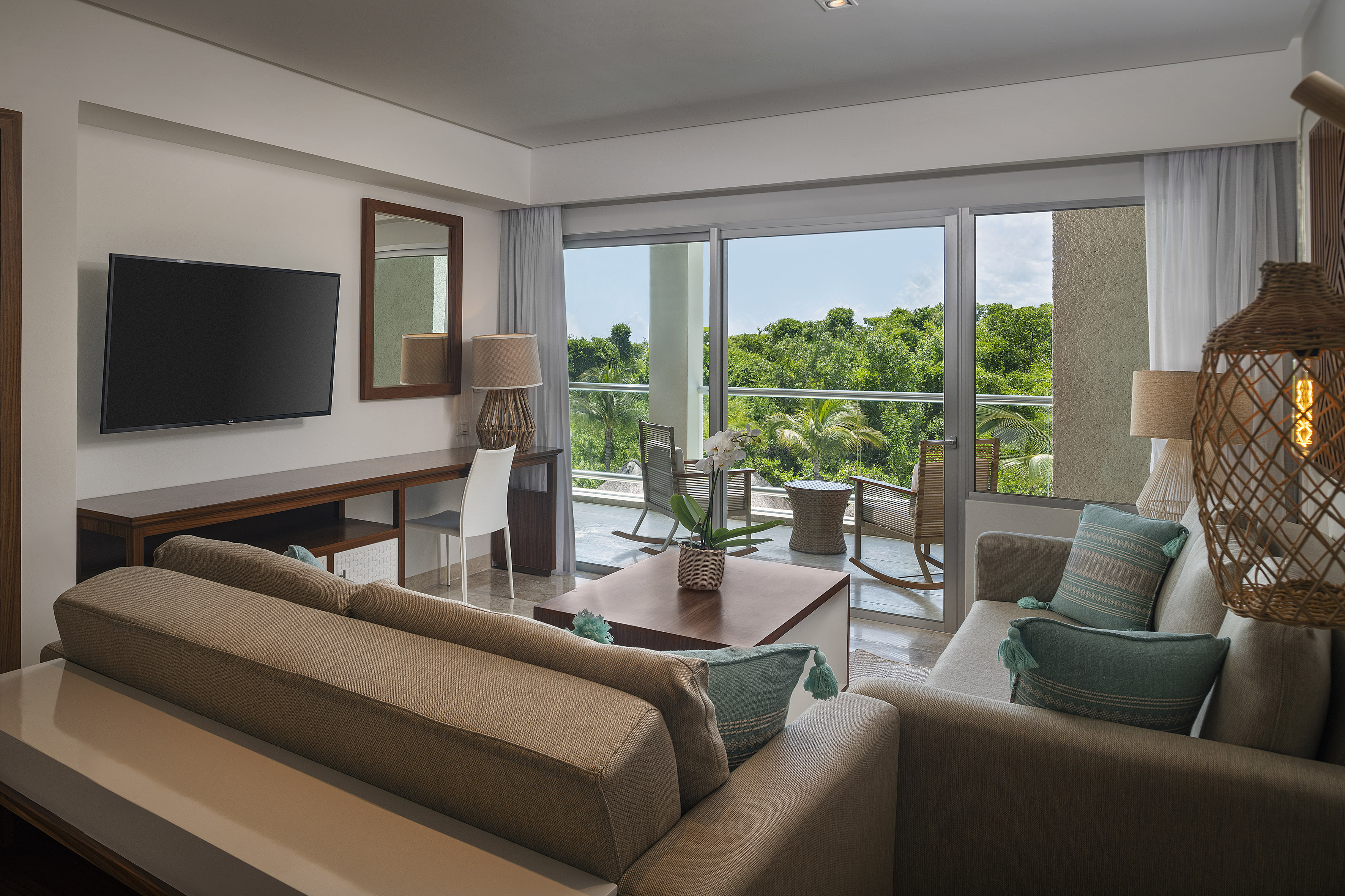 a living room with a television and a couch