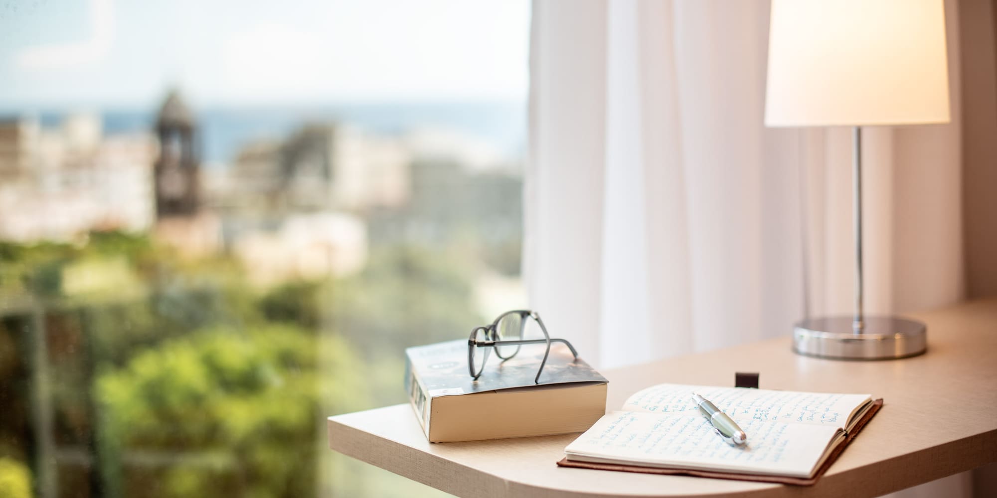 a book and pen on a table