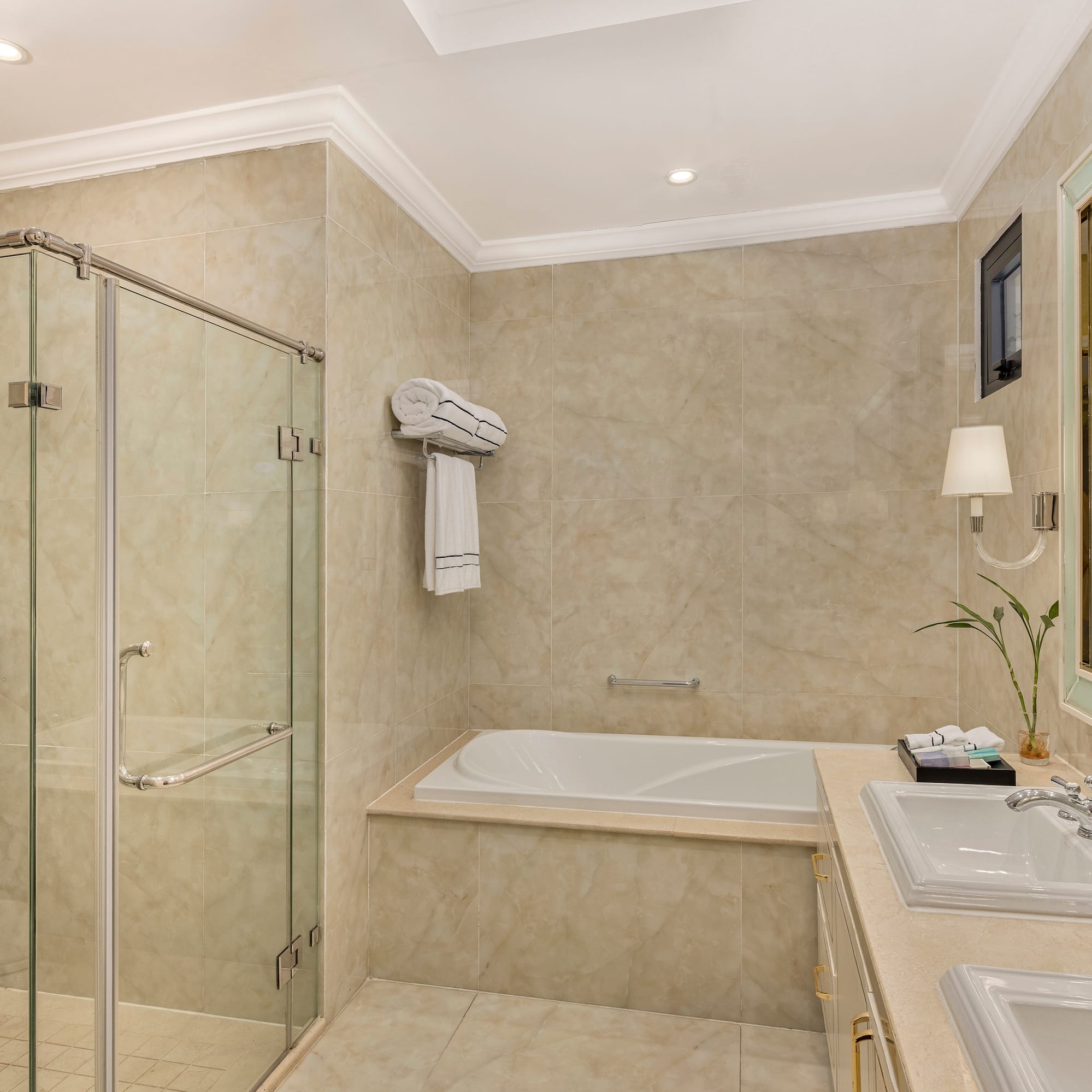 a bathroom with a tub and shower