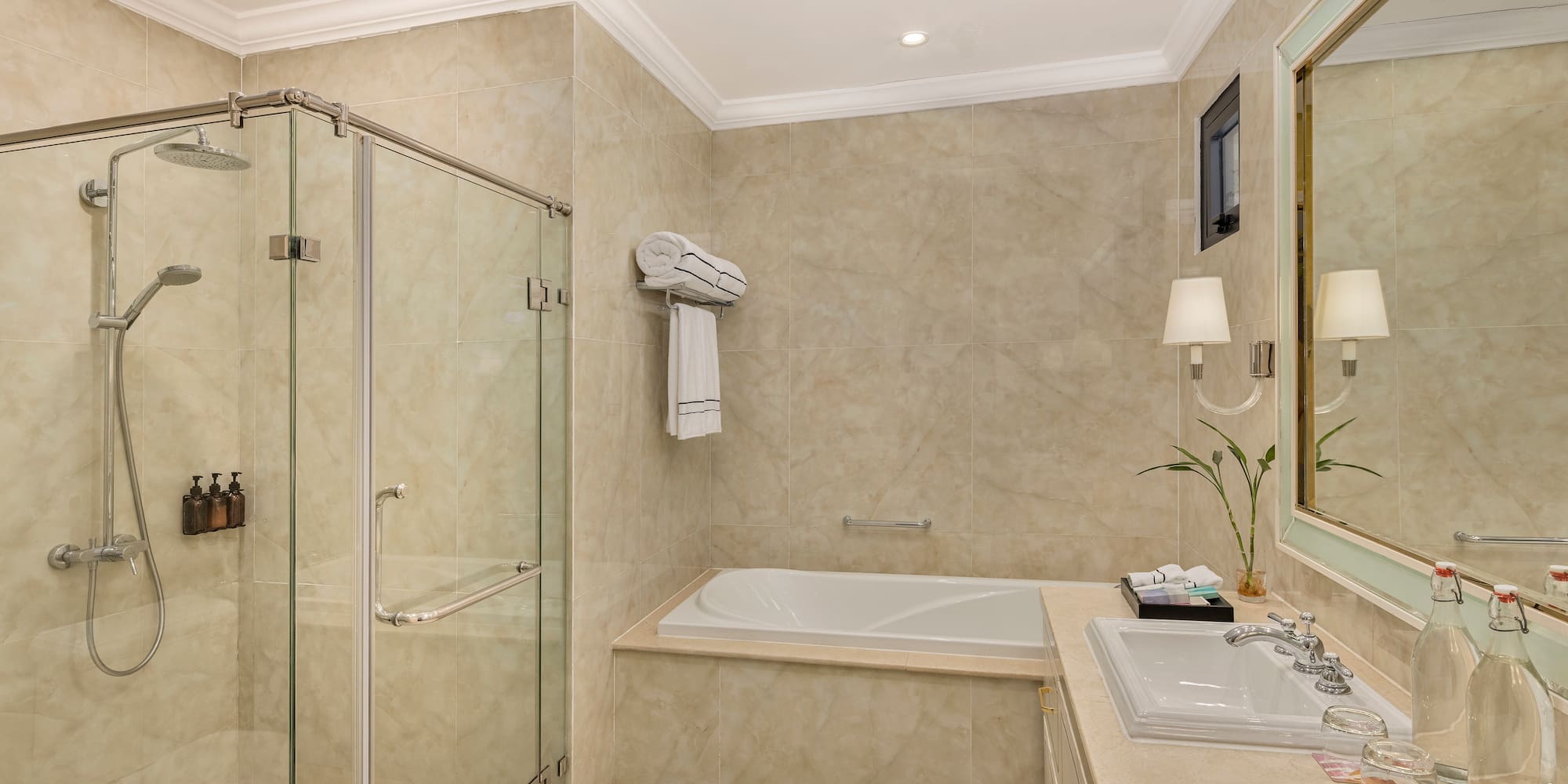 a bathroom with a tub and shower