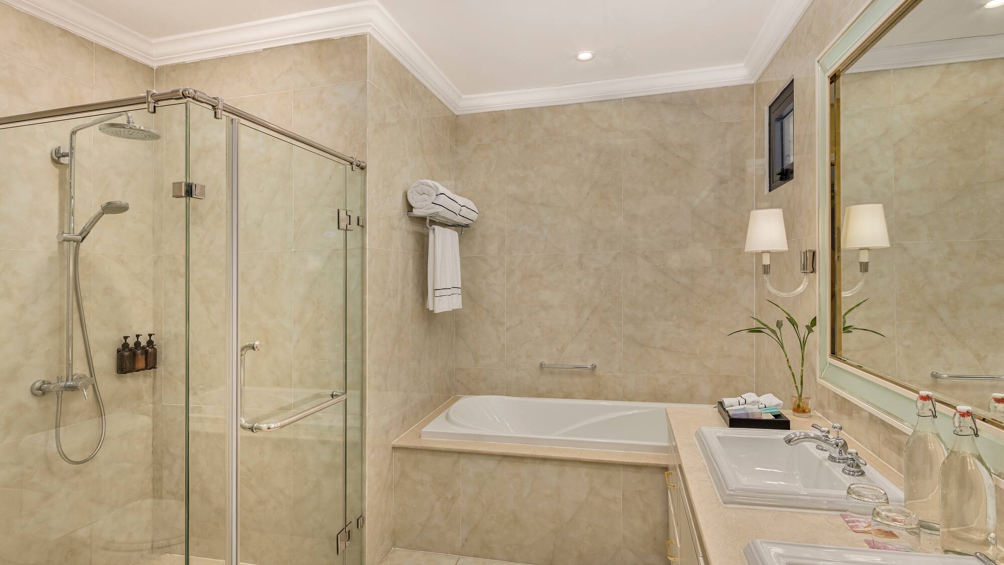 a bathroom with a tub and shower