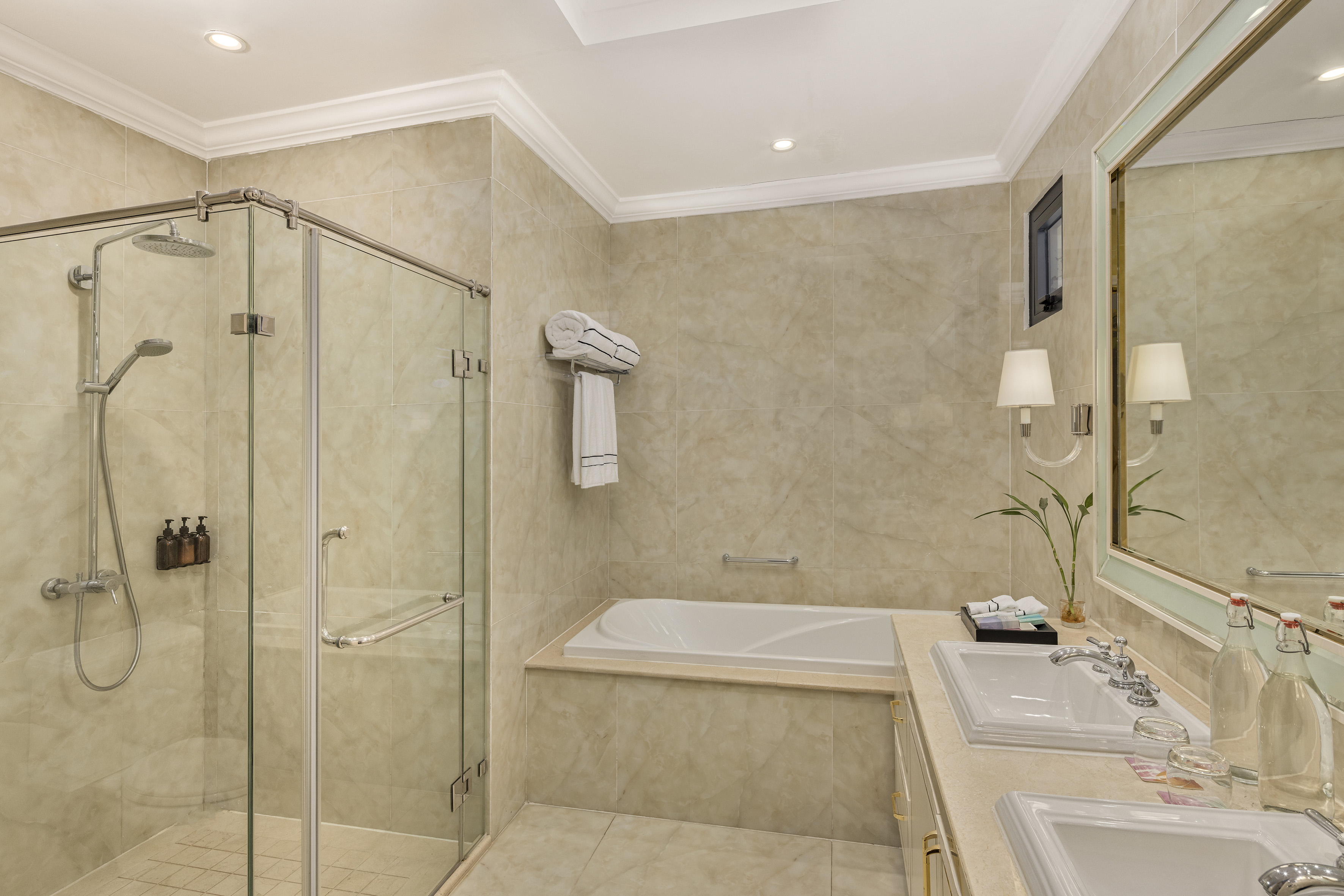 a bathroom with a tub and shower