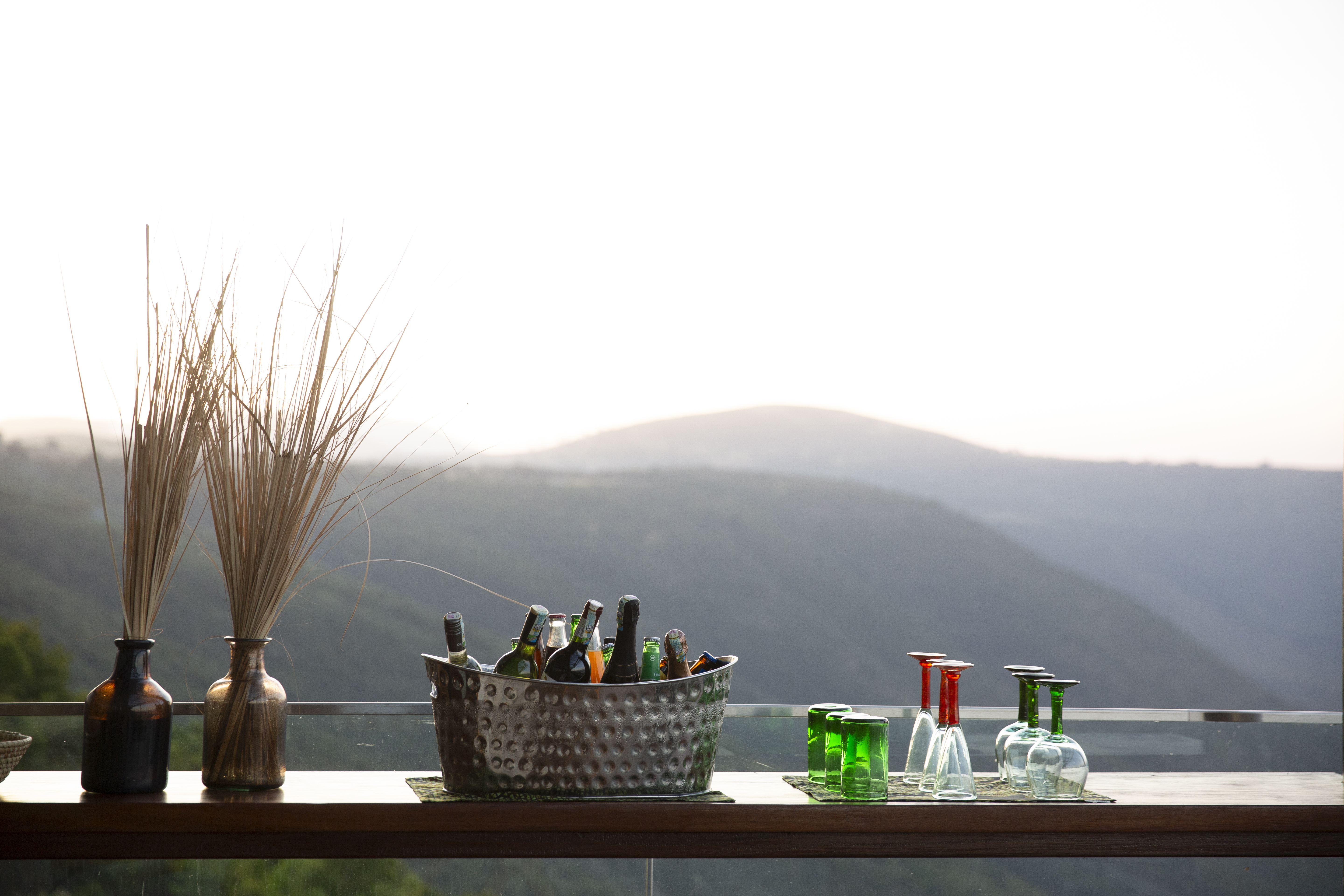 a glass bottles in a basket on a table