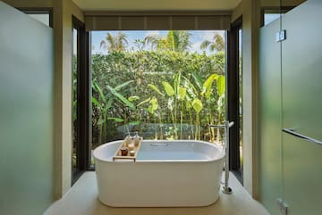 a bathtub in a bathroom with a window