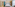 Modern hotel room with king bed, glass shower, teal accent, and sheer curtains.