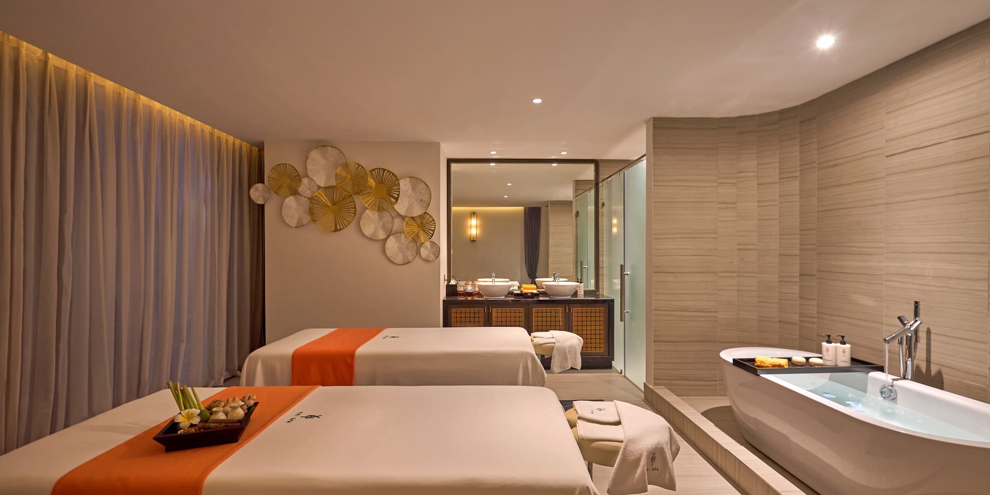 a room with two beds and a bathtub