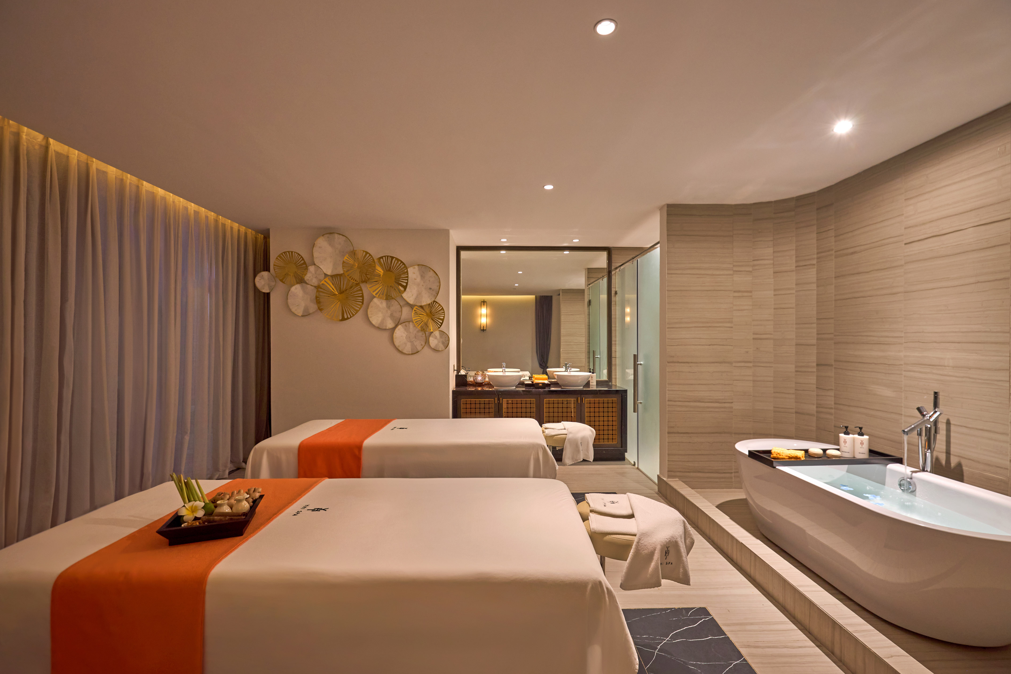 a room with two beds and a bathtub