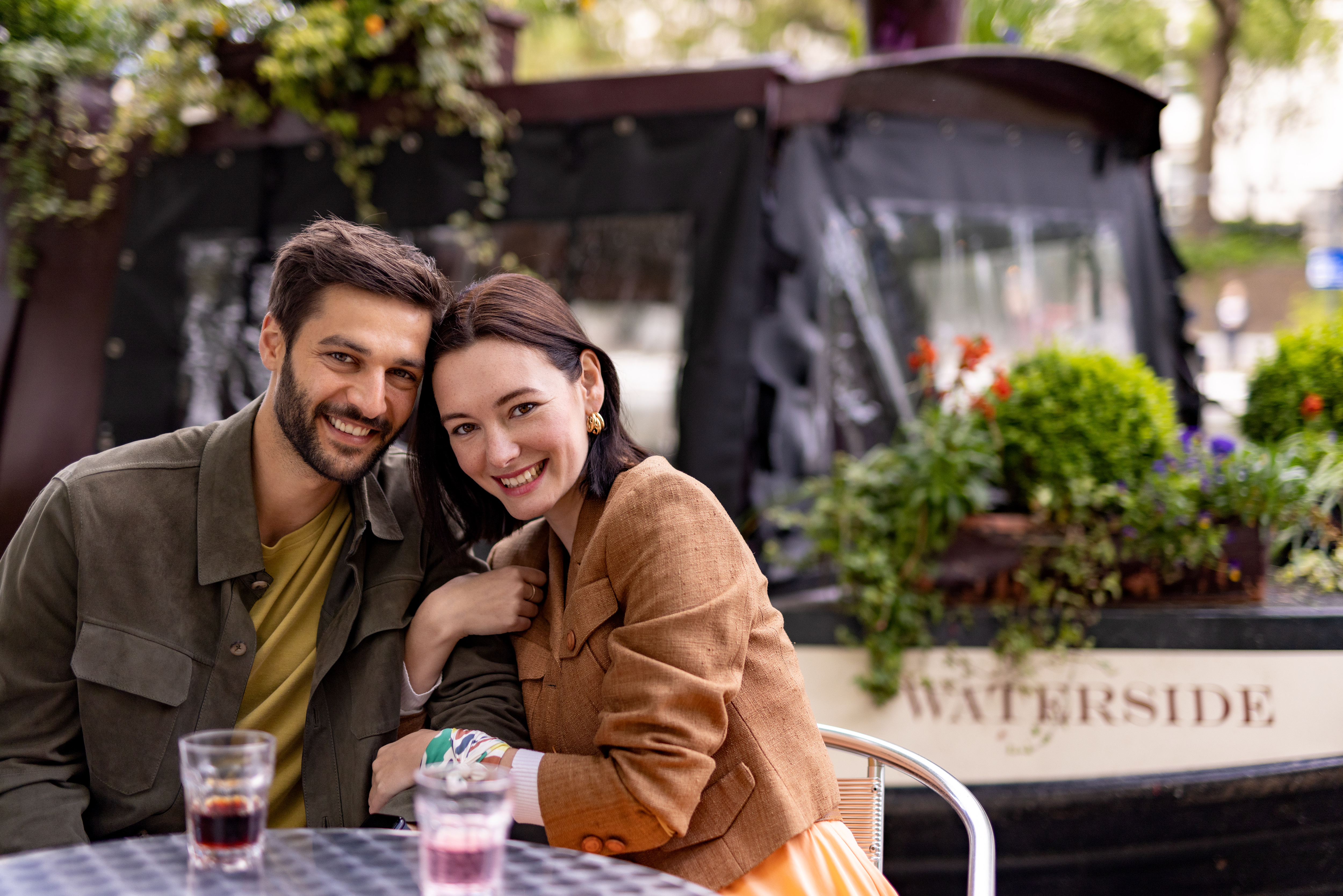 a man and woman sitting at a table