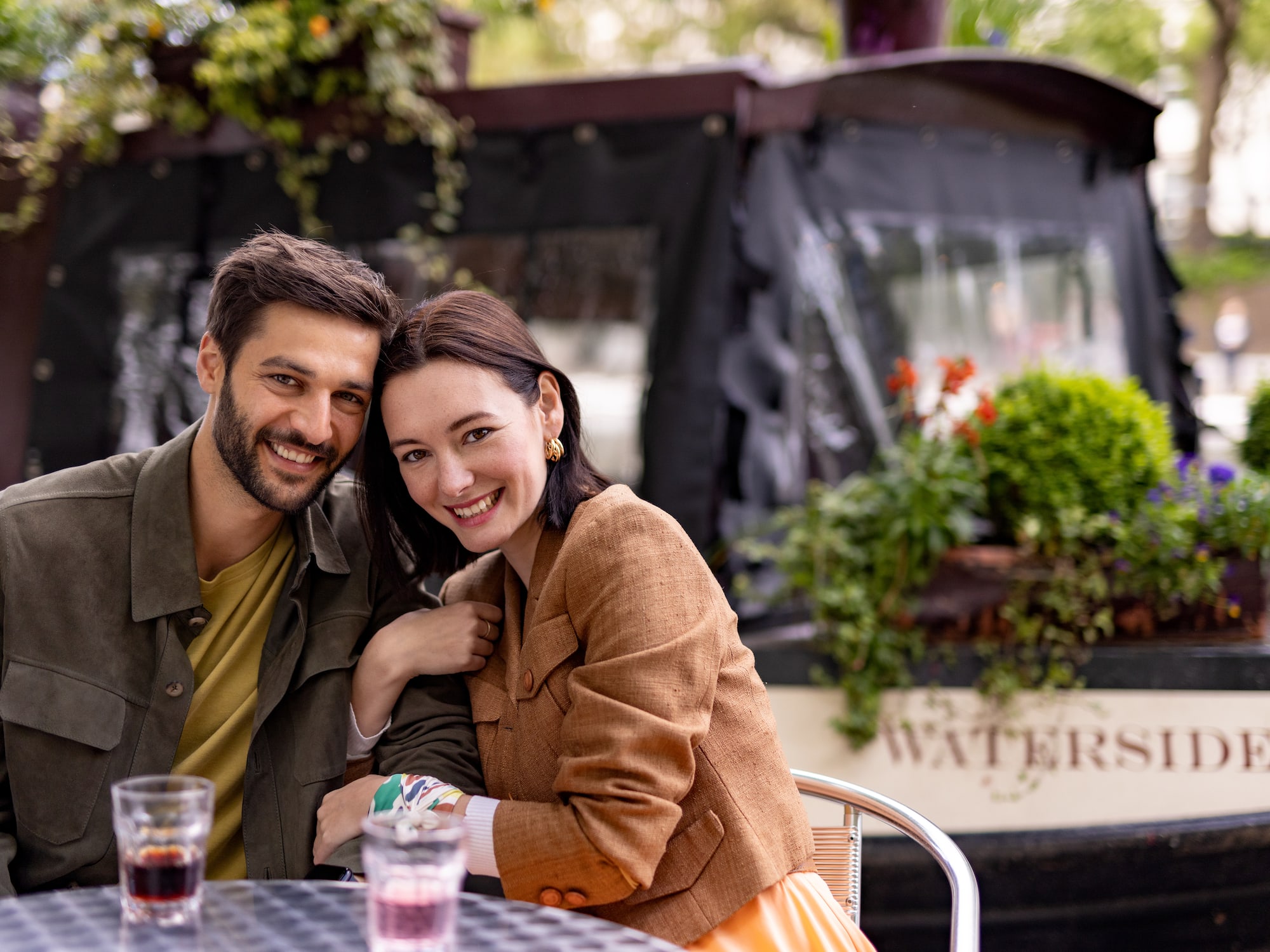 a man and woman sitting at a table