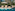 a pool with chairs and umbrella